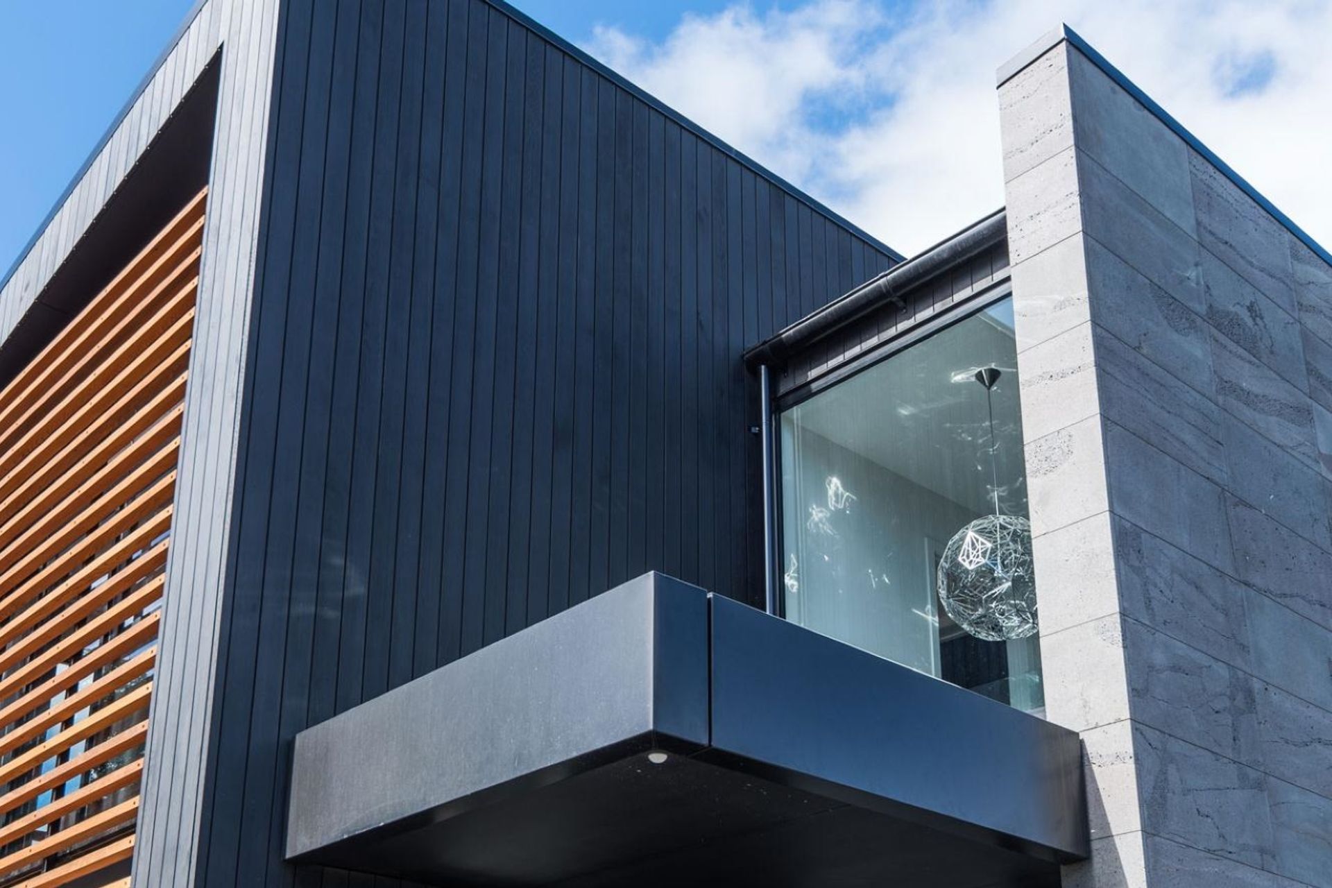 High-quality material choices make the best homes what they are, like the stunning cedar weatherboards and bluestone cladding in this Merivale home.