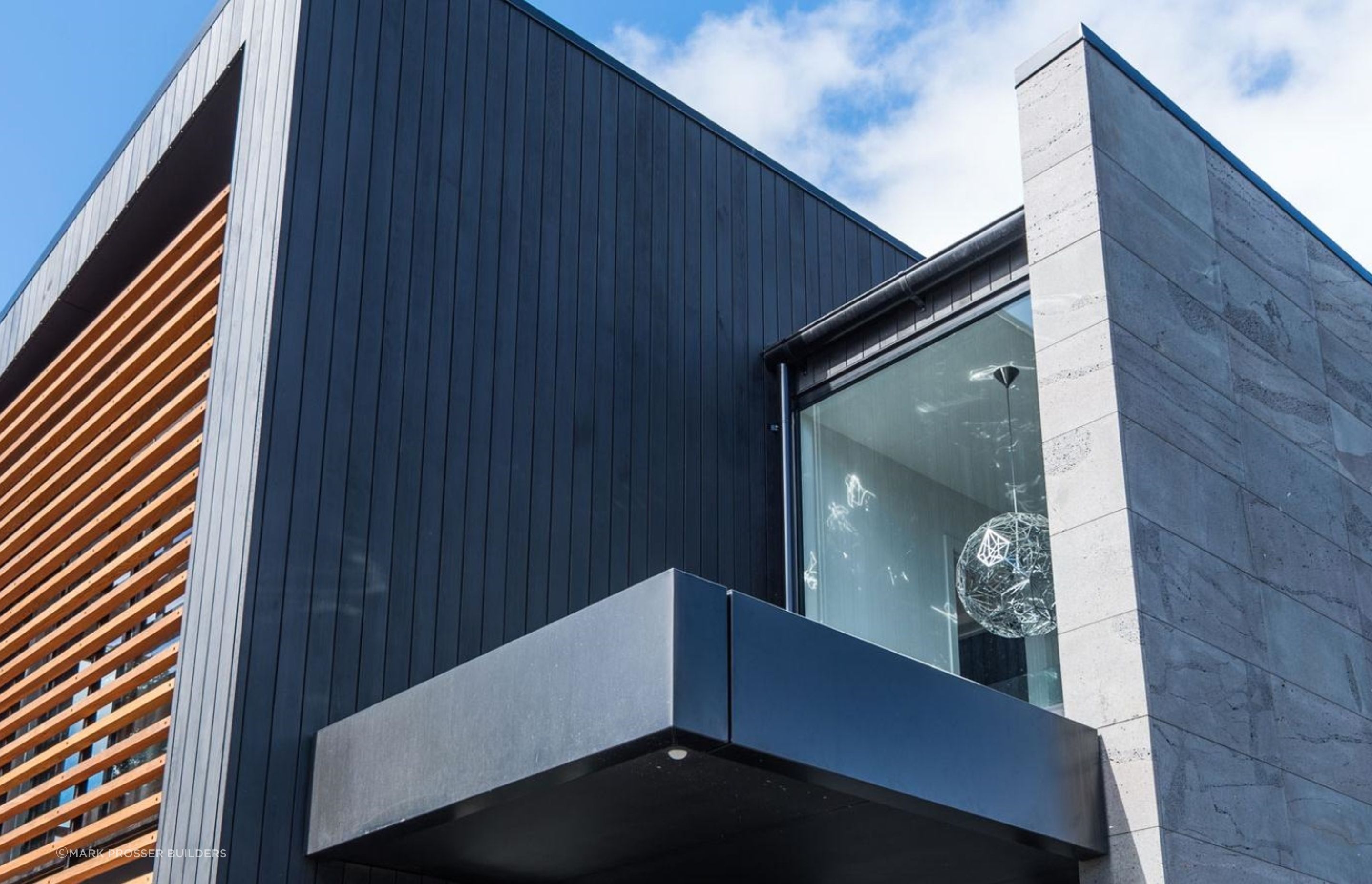 High-quality material choices make the best homes what they are, like the stunning cedar weatherboards and bluestone cladding in this Merivale home.