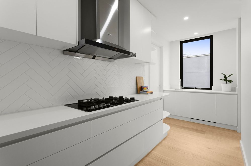 Spot the dishwasher?... The subtle style of a fully integrated ASKO dishwasher in this Mont Albert Project by Cellstruct Building Group. | Photography: Grant Kennedy