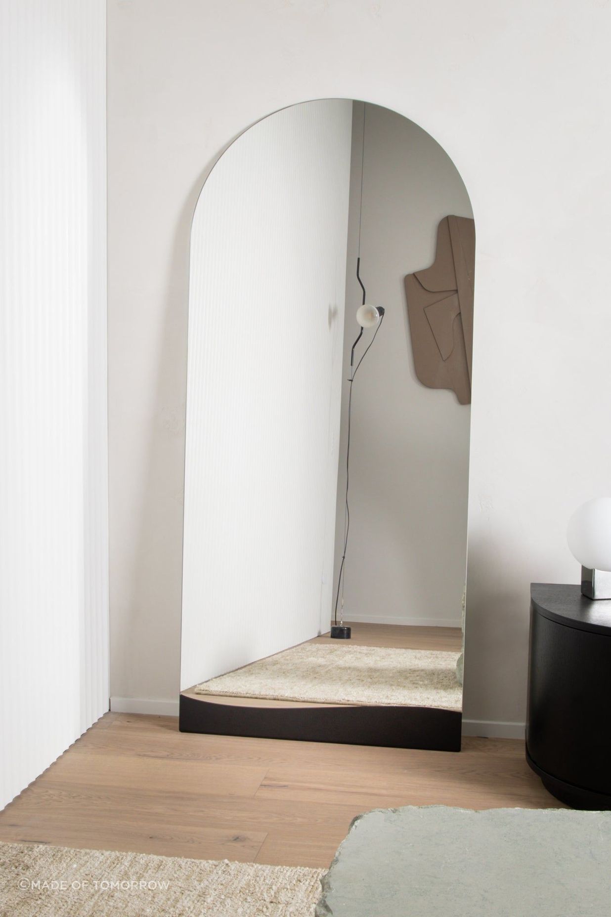 The elegant Arch Full Length Mirror, similarly positioned in a vacant corner.