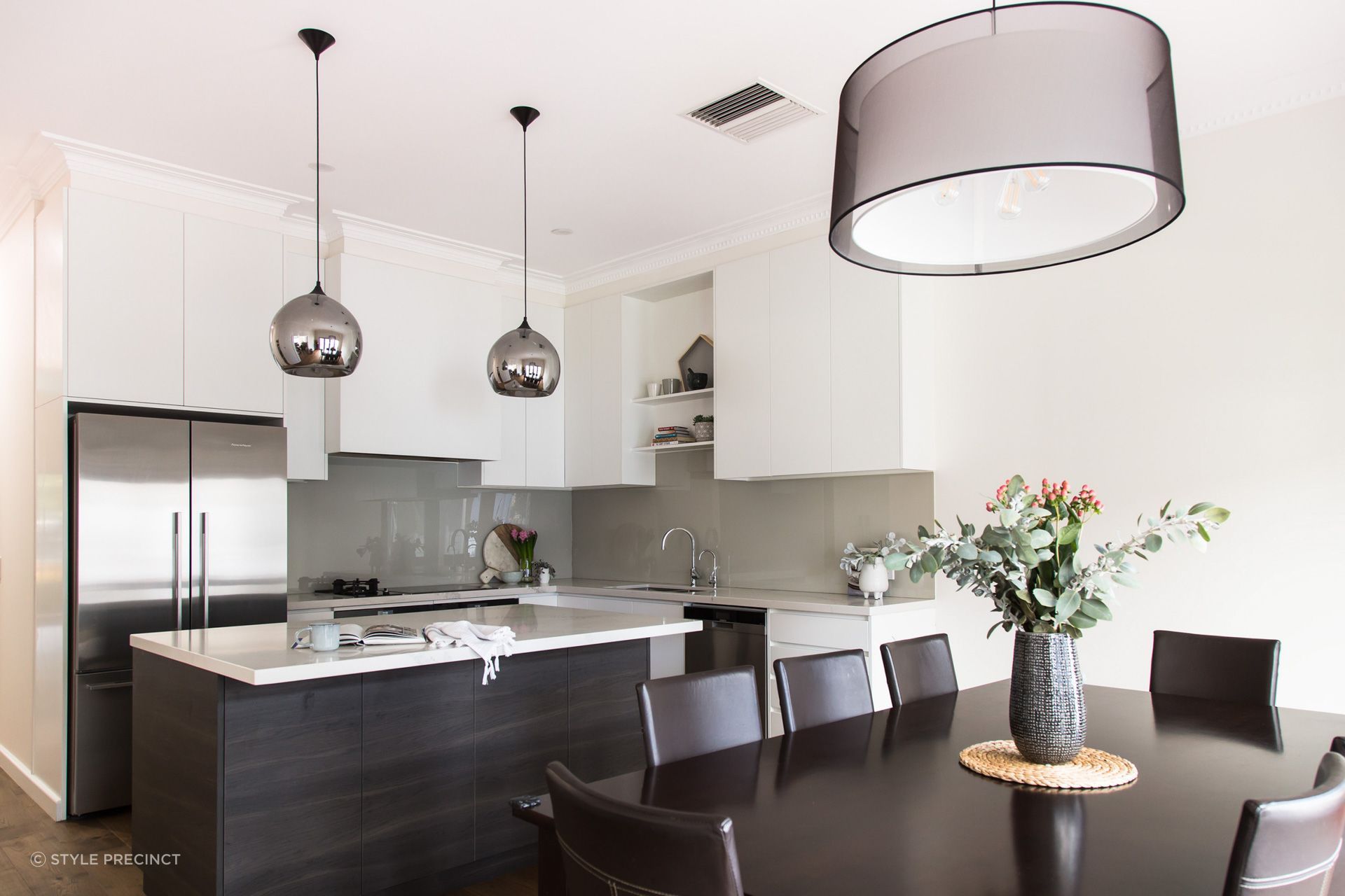 Reflective surfaces such as a fridge, or particular lighting fixtures help reflect light around the room. Photography: Suzi Appel.