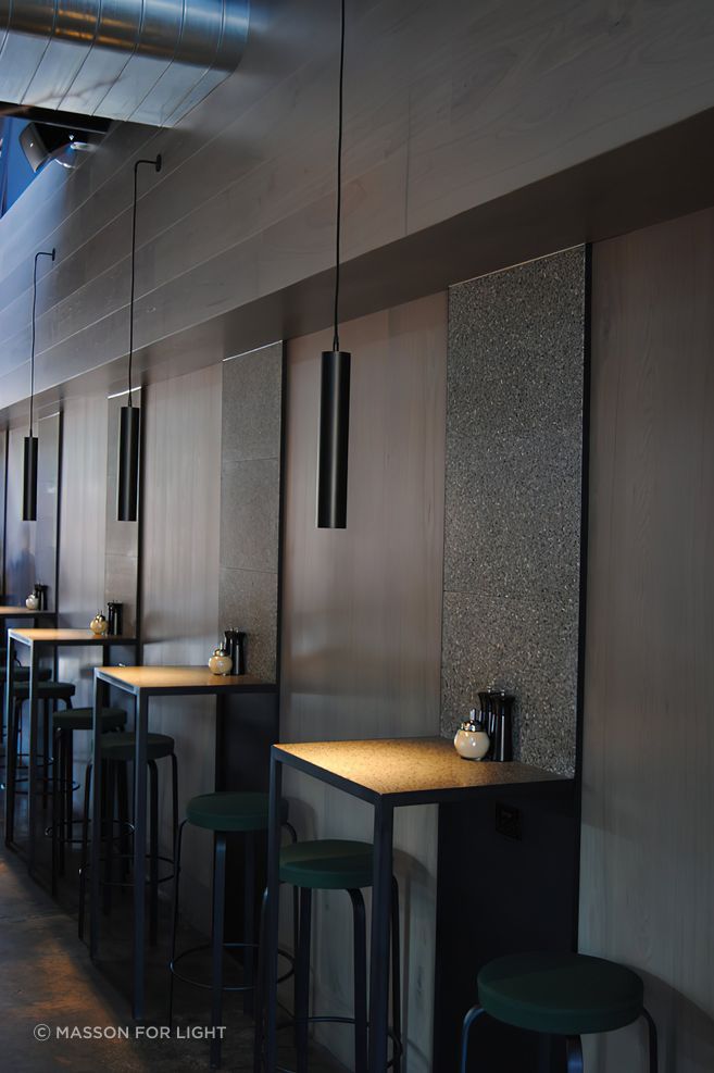 A single pendant sets the mood for each table.