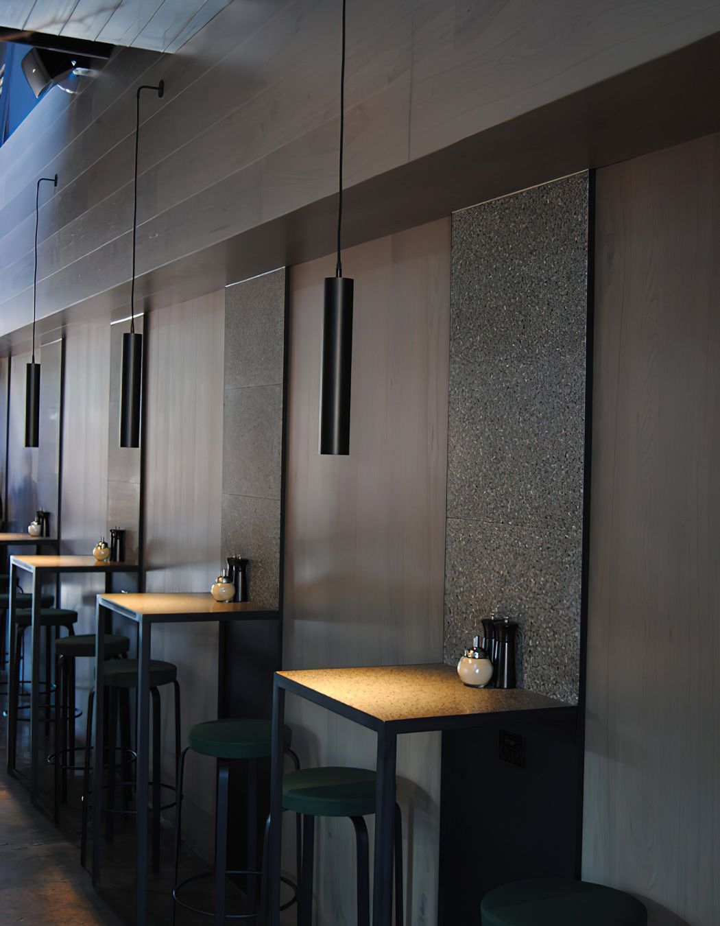 A single pendant sets the mood for each table.