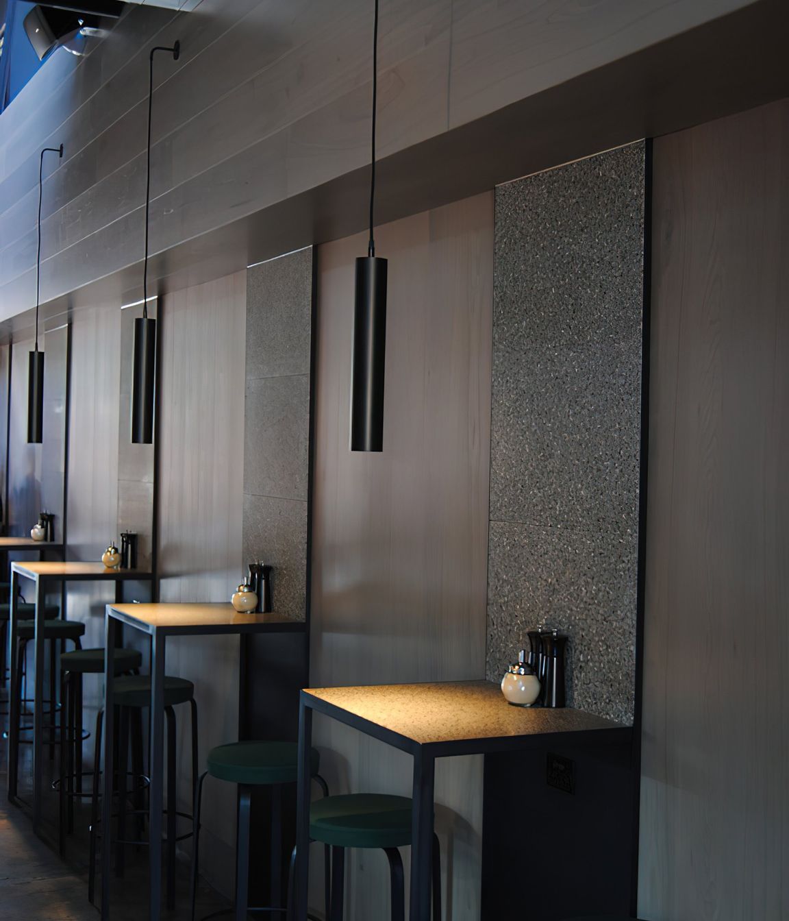 A single pendant sets the mood for each table.