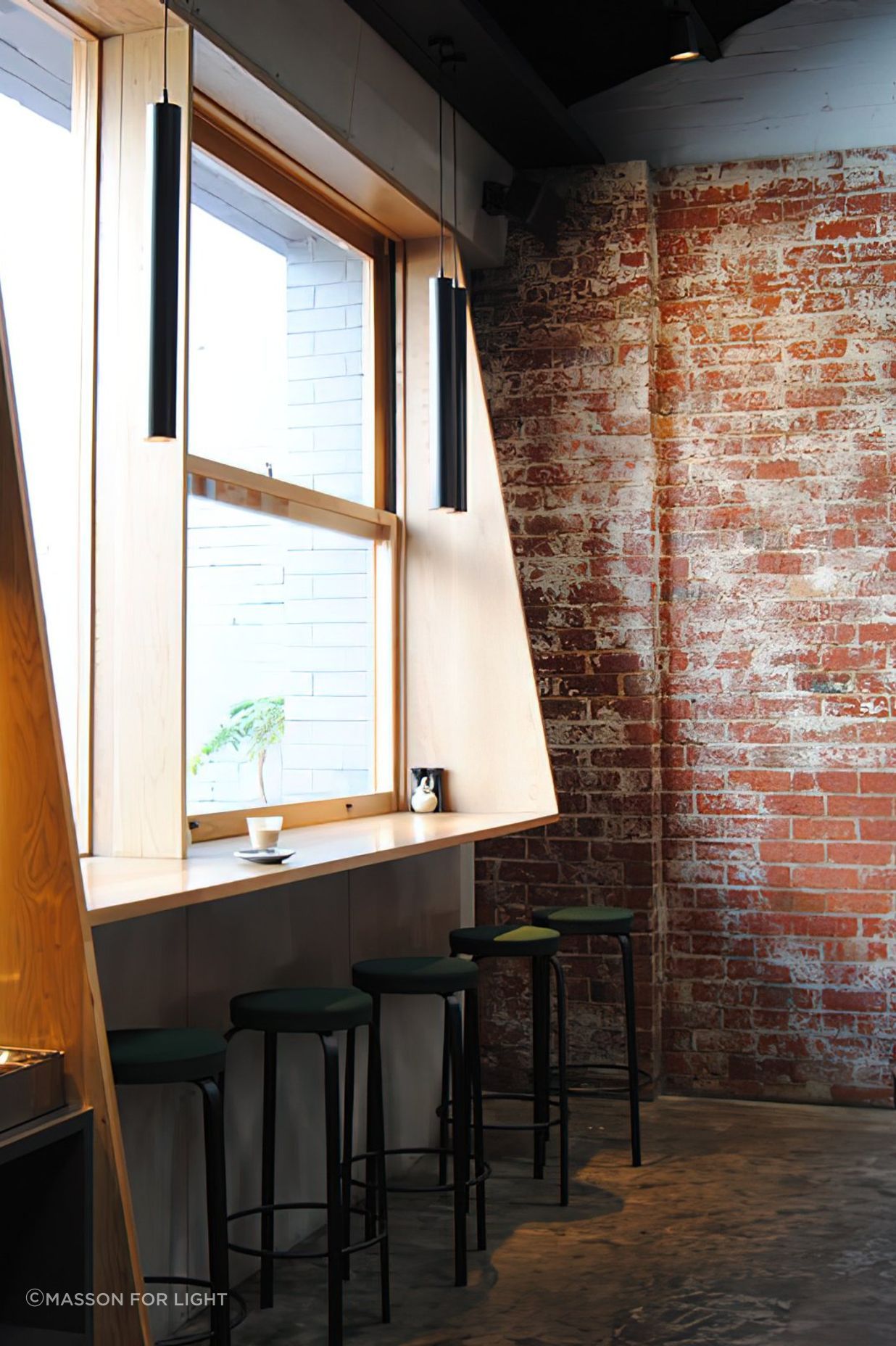 Exposed brickwork and beams create an industrial feel.