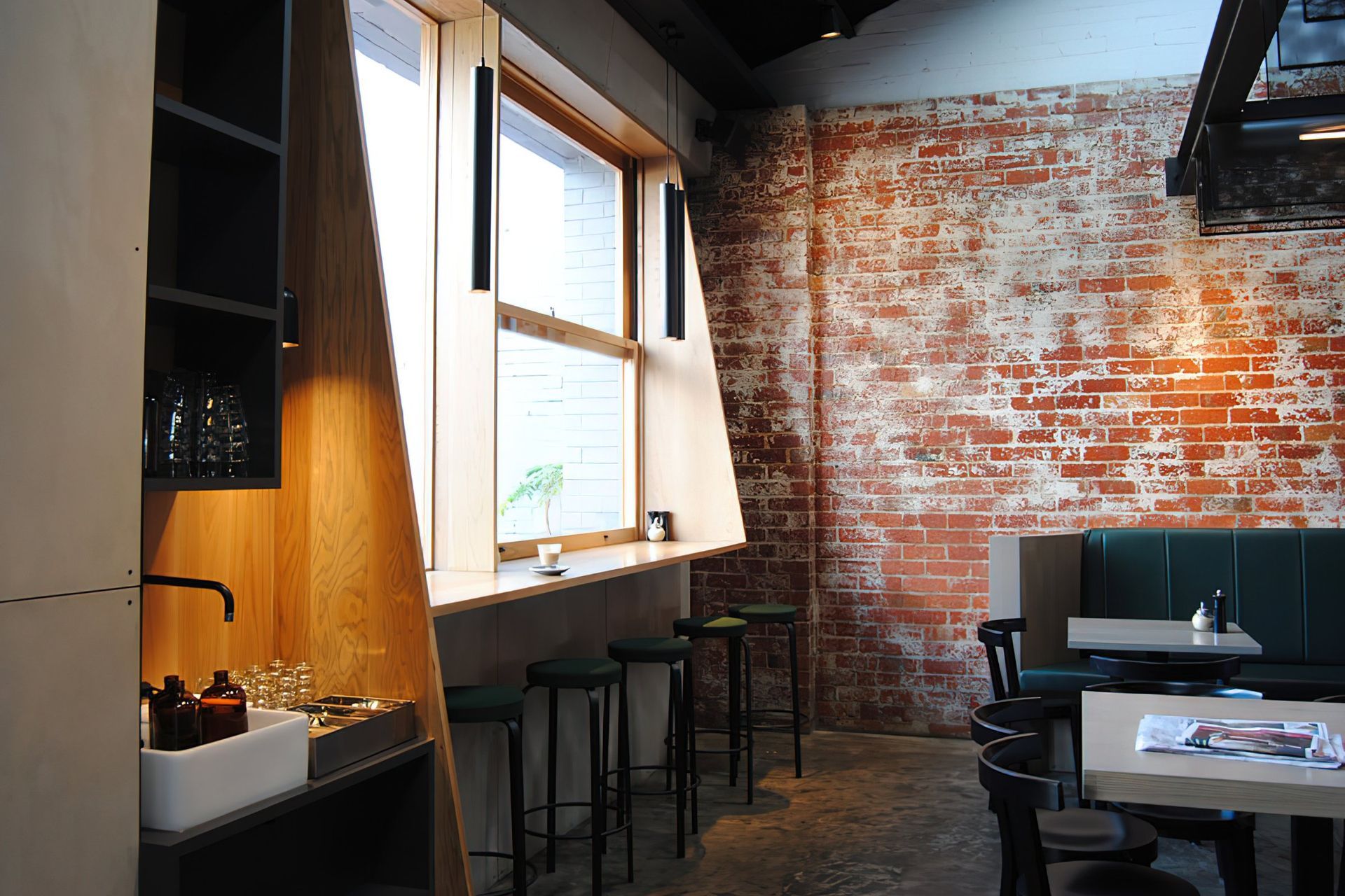 Exposed brickwork and beams create an industrial feel.