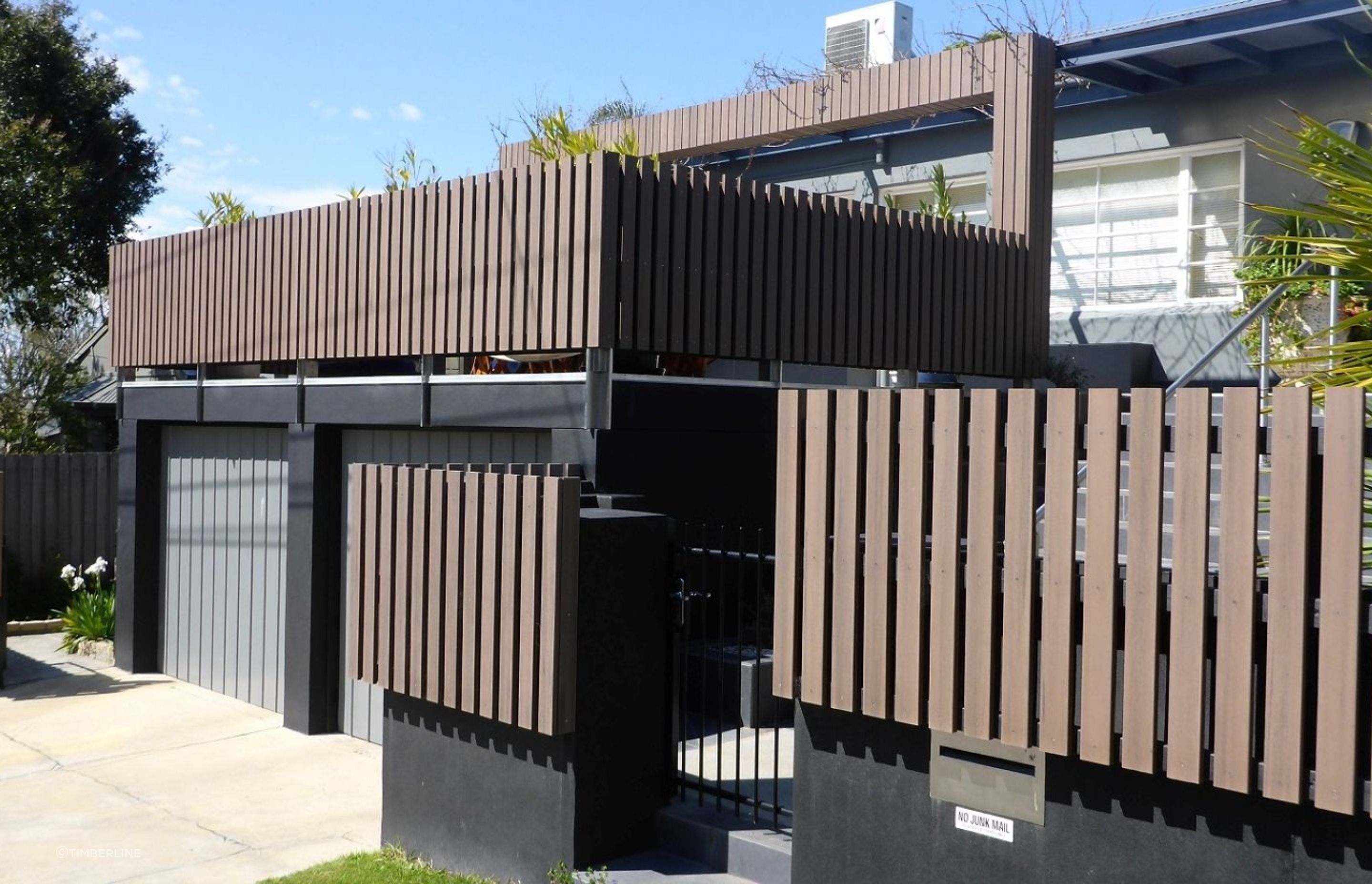 A stylish example of composite fencing with the Modwood Black Bean Screening.