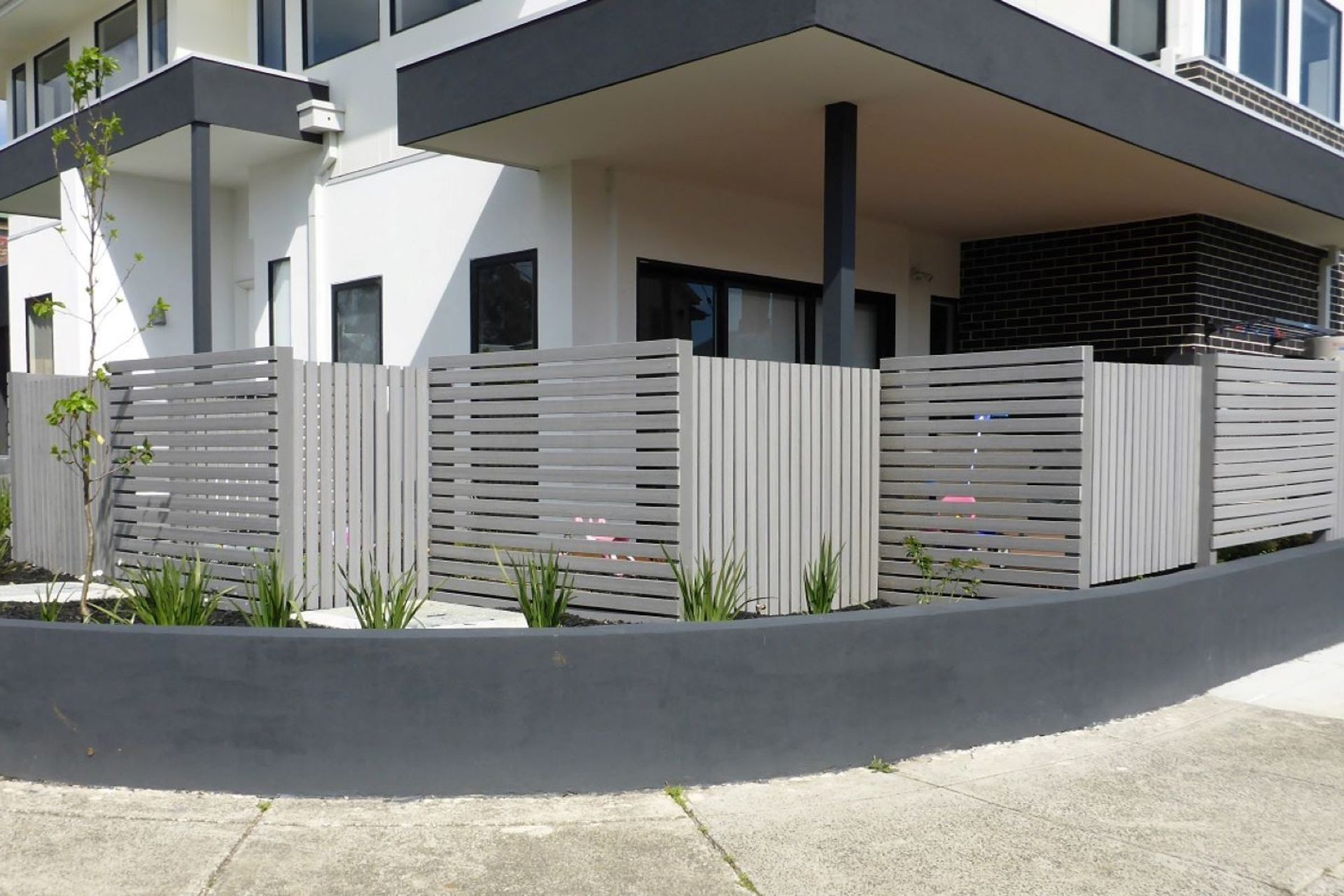 Options like the ModWood Silver Gum Composite Screening show just how authentic the look of composite fencing can be.