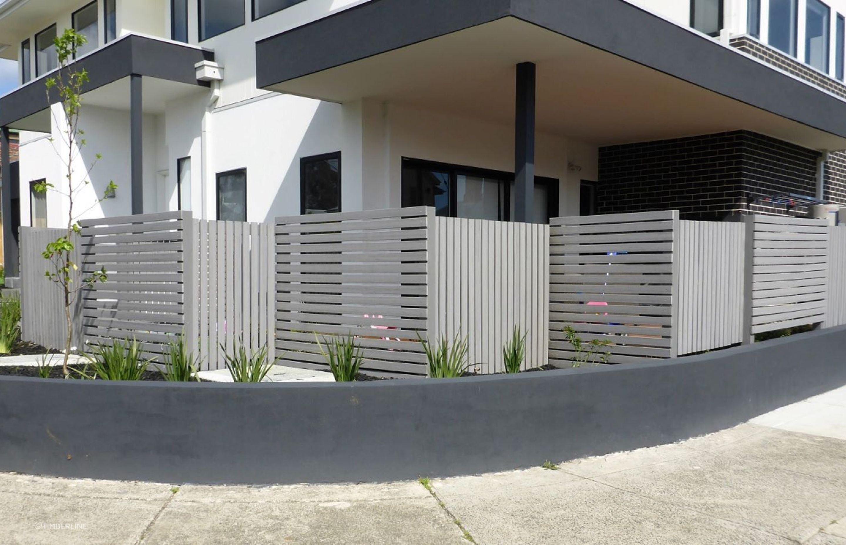 Options like the ModWood Silver Gum Composite Screening show just how authentic the look of composite fencing can be.