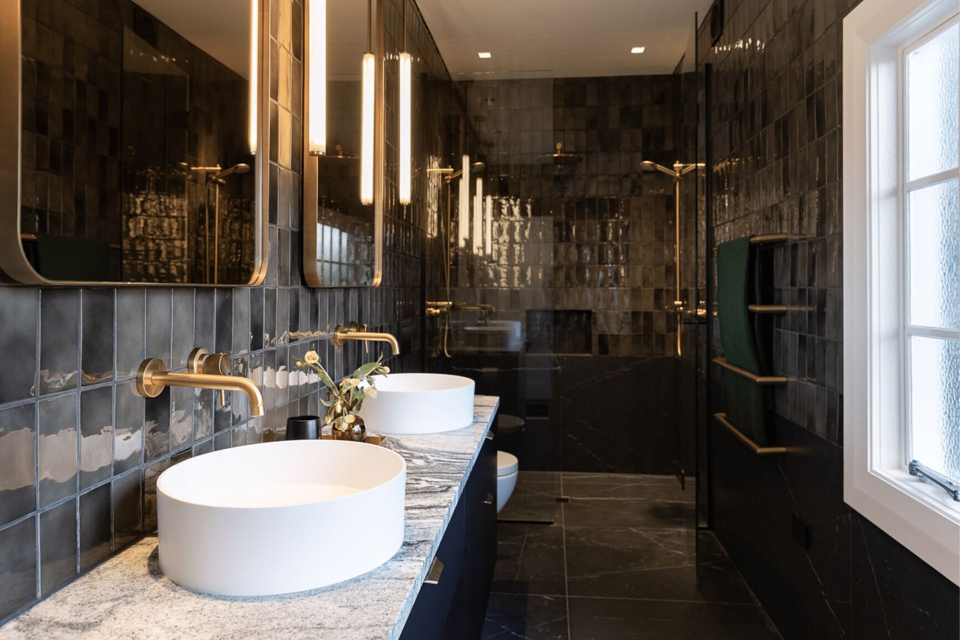 The glossy tiles of this bathroom in Mount Eden adds an undeniable shine.