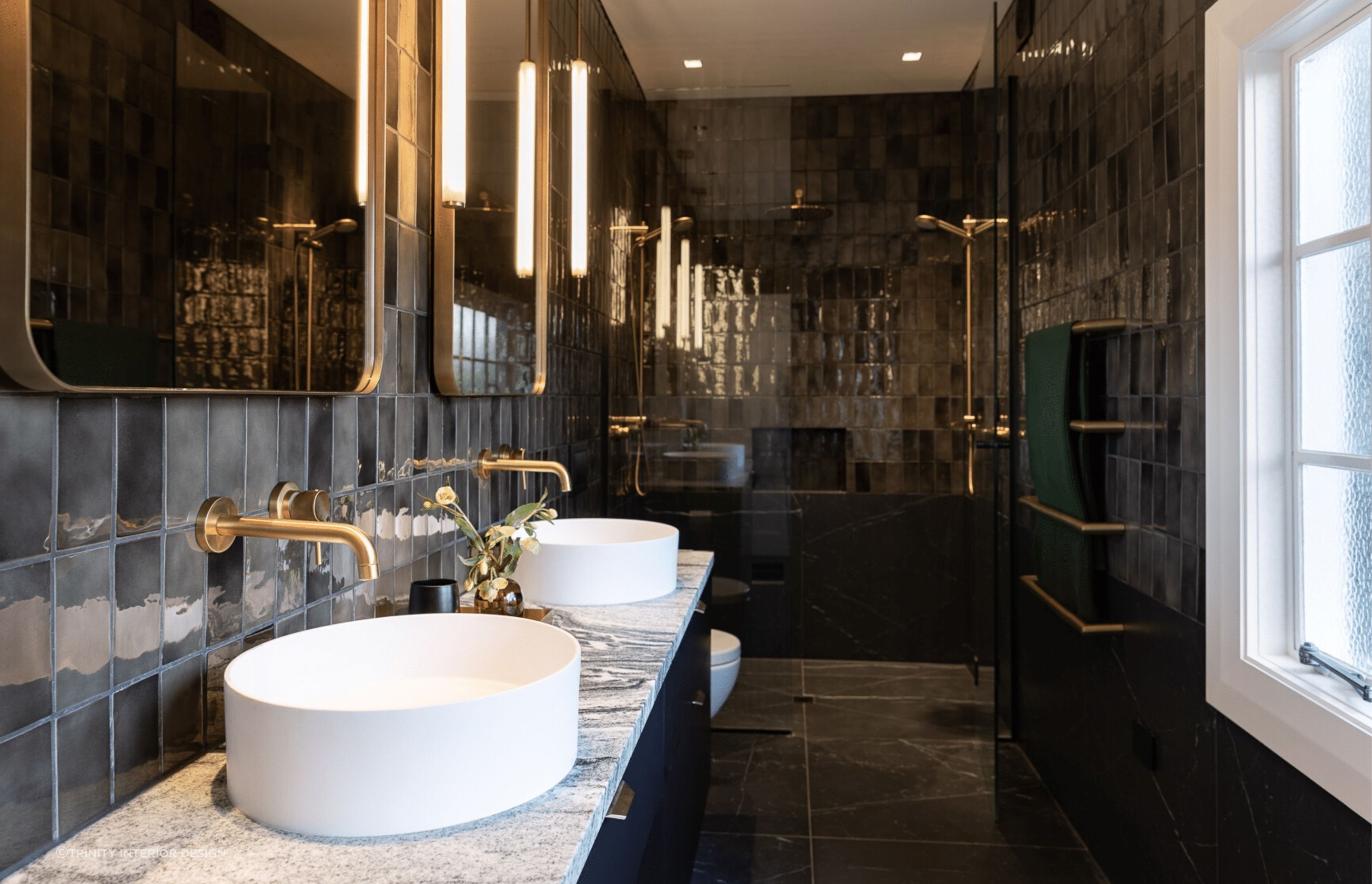 The glossy tiles of this bathroom in Mount Eden adds an undeniable shine.