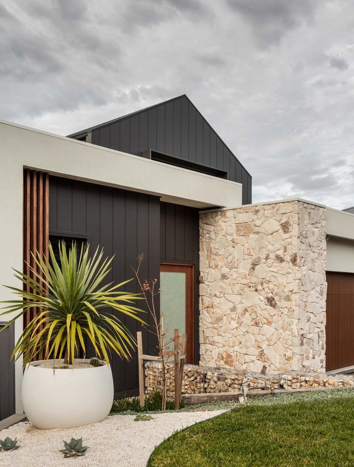 Natural stone cladding can is often used on a homes exterior in conjunction with other external cladding materials. Featured product: Callala Organic Stone Wall Cladding.