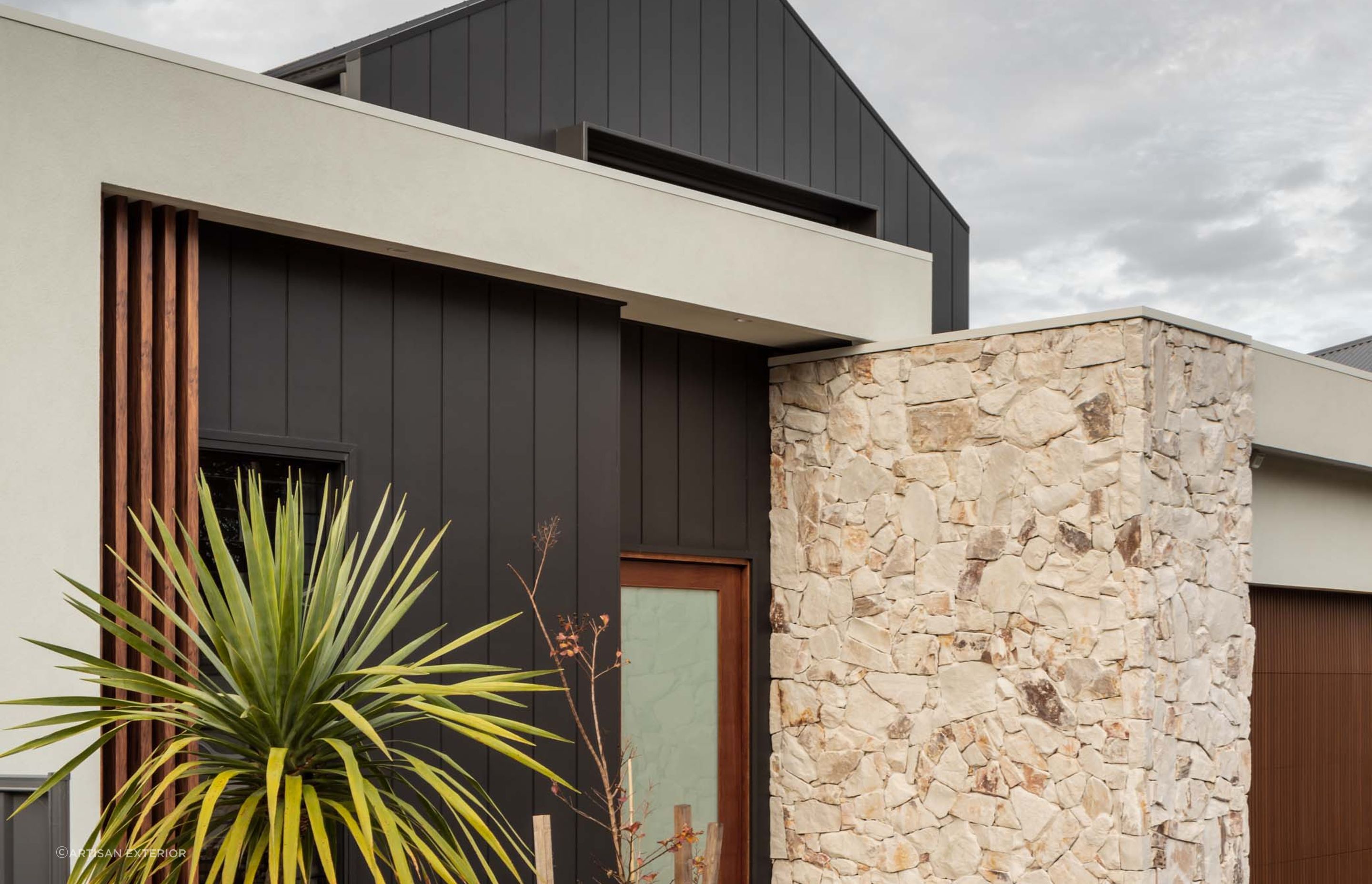 Natural stone cladding can is often used on a homes exterior in conjunction with other external cladding materials. Featured product: Callala Organic Stone Wall Cladding.