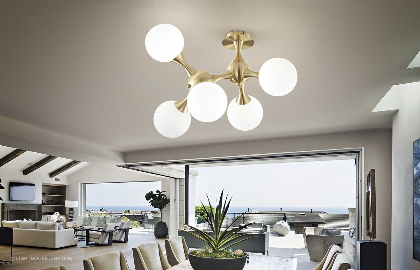 The Nodi Ceiling Light from Lighthouse Lighting offers pendant light qualities with its semi flush mount design.