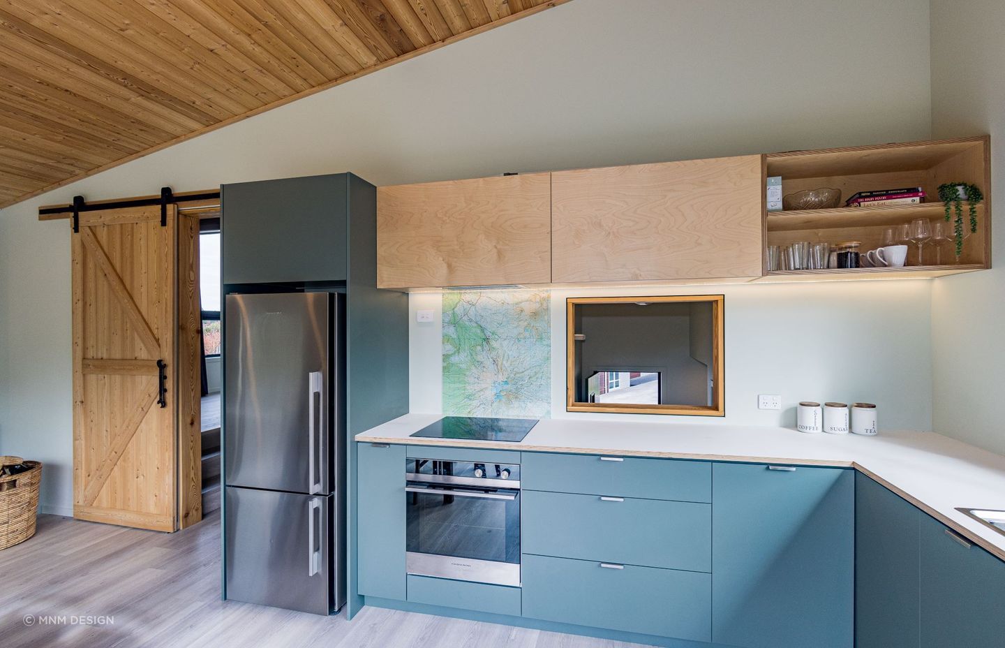 A splashback that features a map as a tribute to the region in this cosy home in Ohakune —Photography: Glyn Hubbard Photography