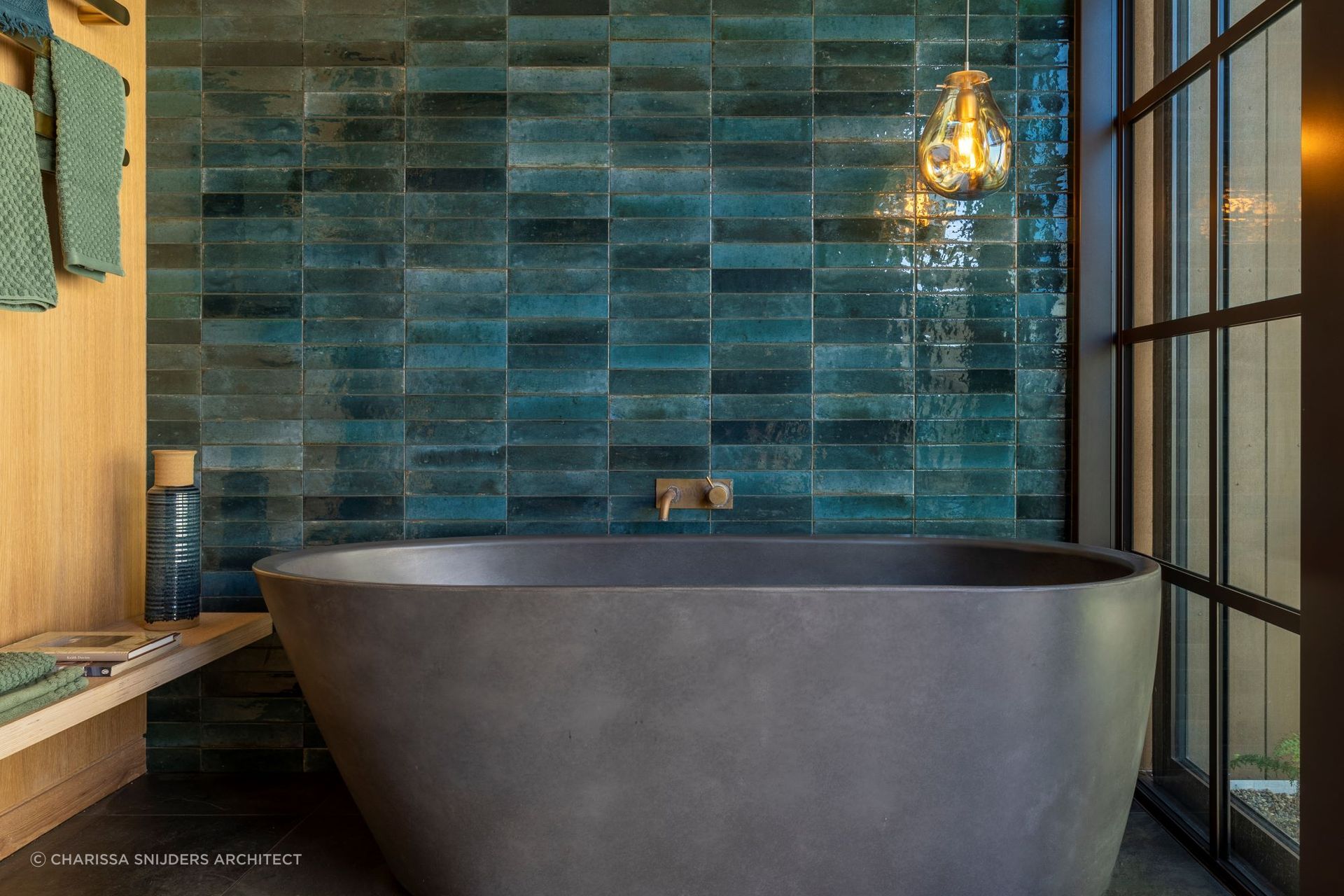 This beautiful bathroom in a Waiheke Island home has a colour schemed inspired by the local kingfishers — Photography: Bridget Hackshaw