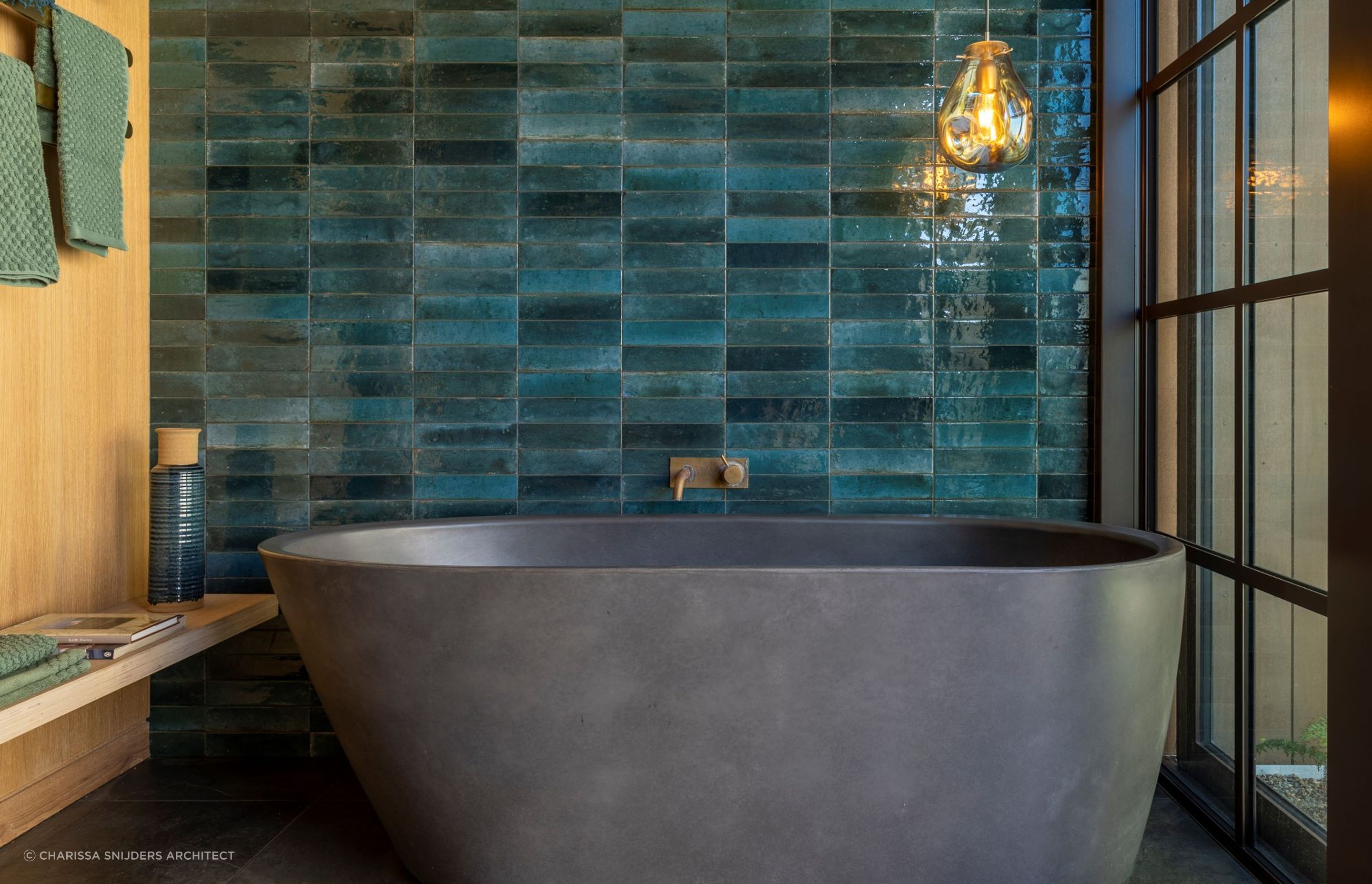 This beautiful bathroom in a Waiheke Island home has a colour schemed inspired by the local kingfishers — Photography: Bridget Hackshaw