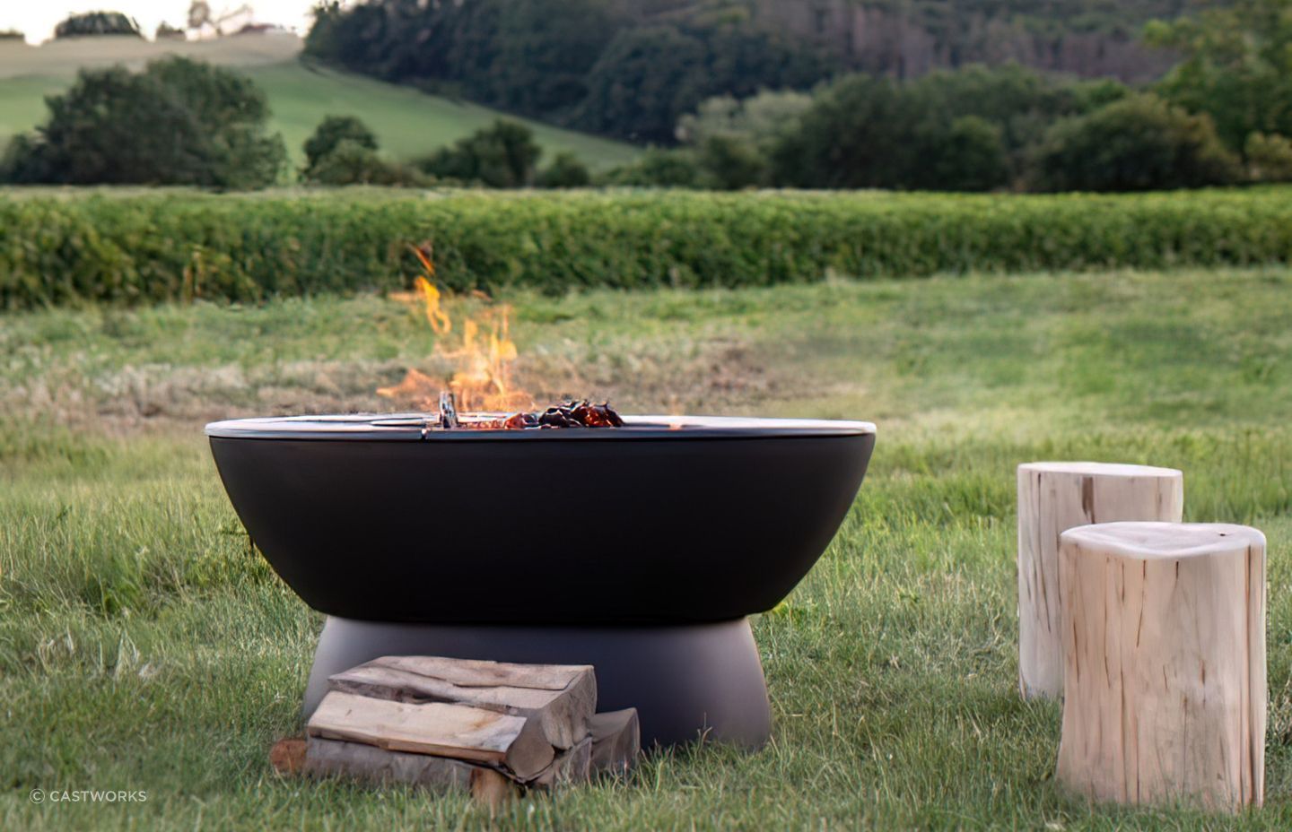 Outdoor fire pits add a rugged, rustic appeal to an outdoor area. Featured product: Hergom Meteor Cast Iron Fire Pit.
