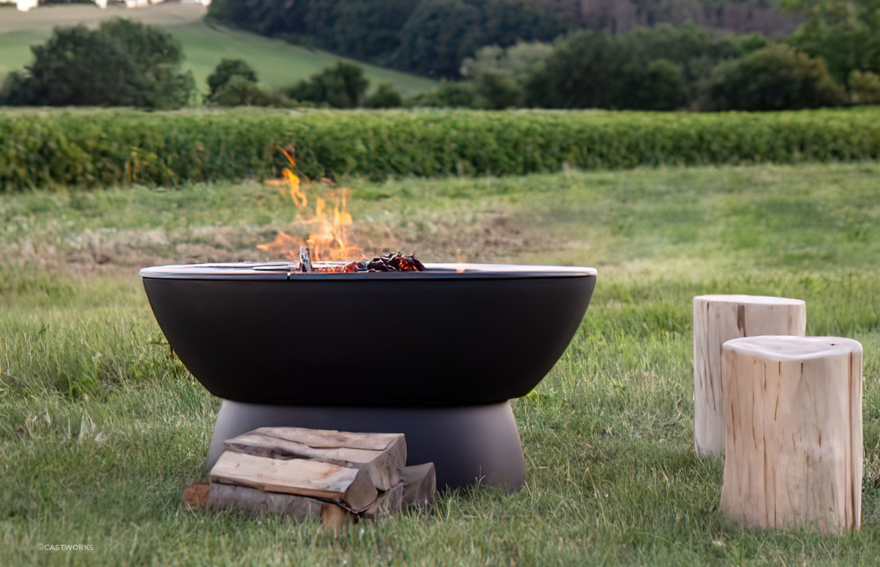 Outdoor fire pits add a rugged, rustic appeal to an outdoor area. Featured product: Hergom Meteor Cast Iron Fire Pit.
