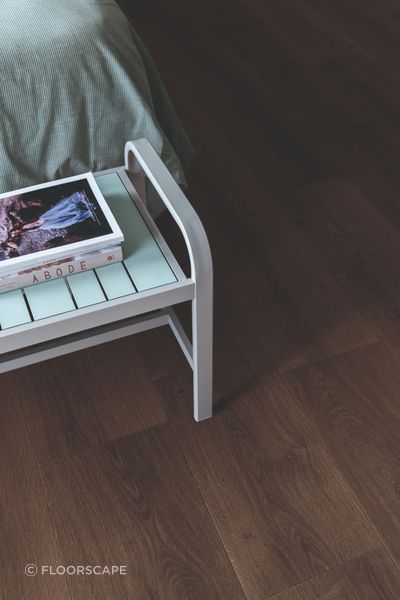 Dark timber tones create a sense of warmth and quiet luxury.