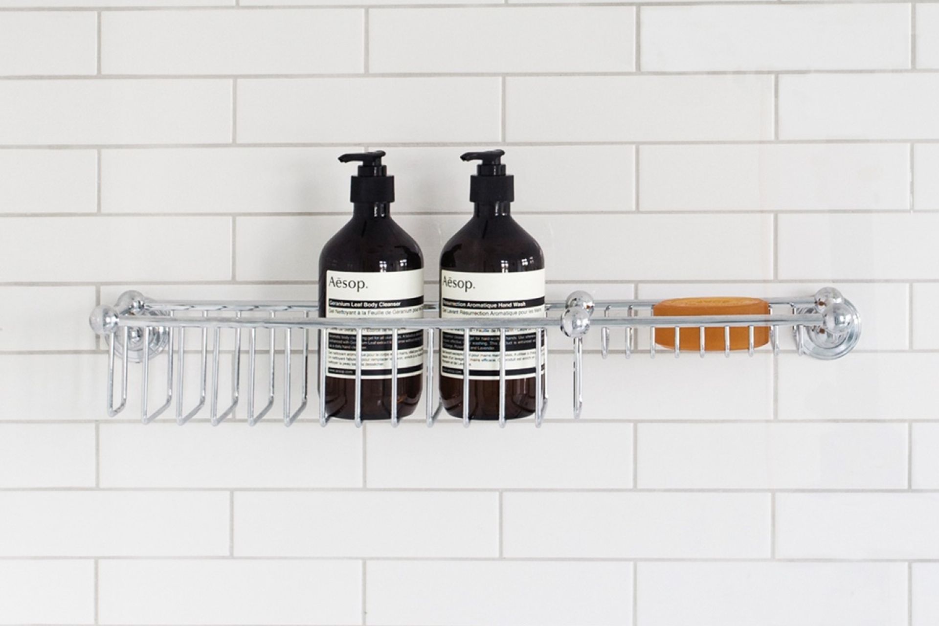 The elegant Perrin & Rowe Shower Basket with Soap Tray allows full drainage for easy cleaning and maintenance.