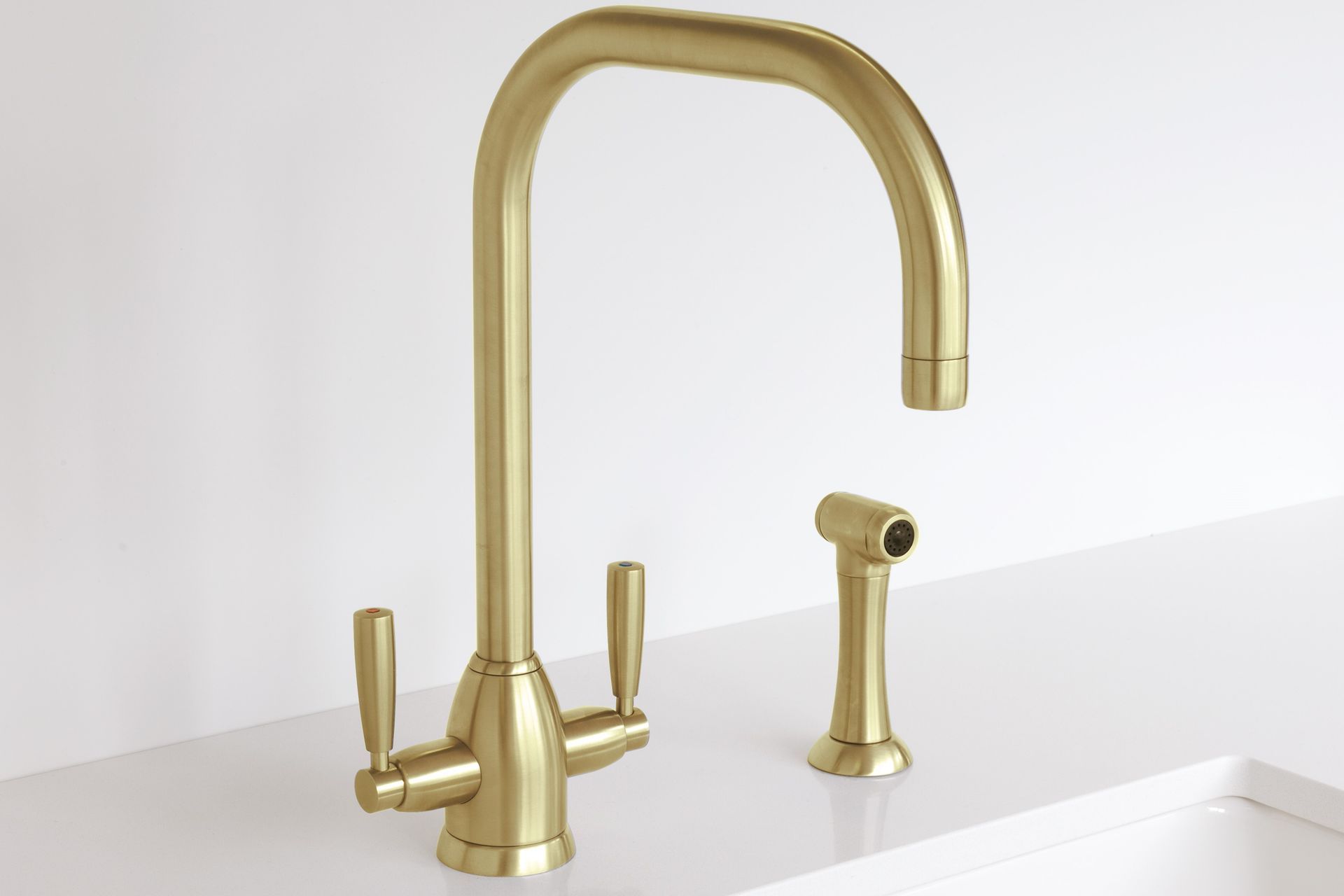 The Perrin & Rowe Oberon Sink Mixer has a contemporary design with ergonomic with twin levers, seen here in a beautiful satin brass finish.