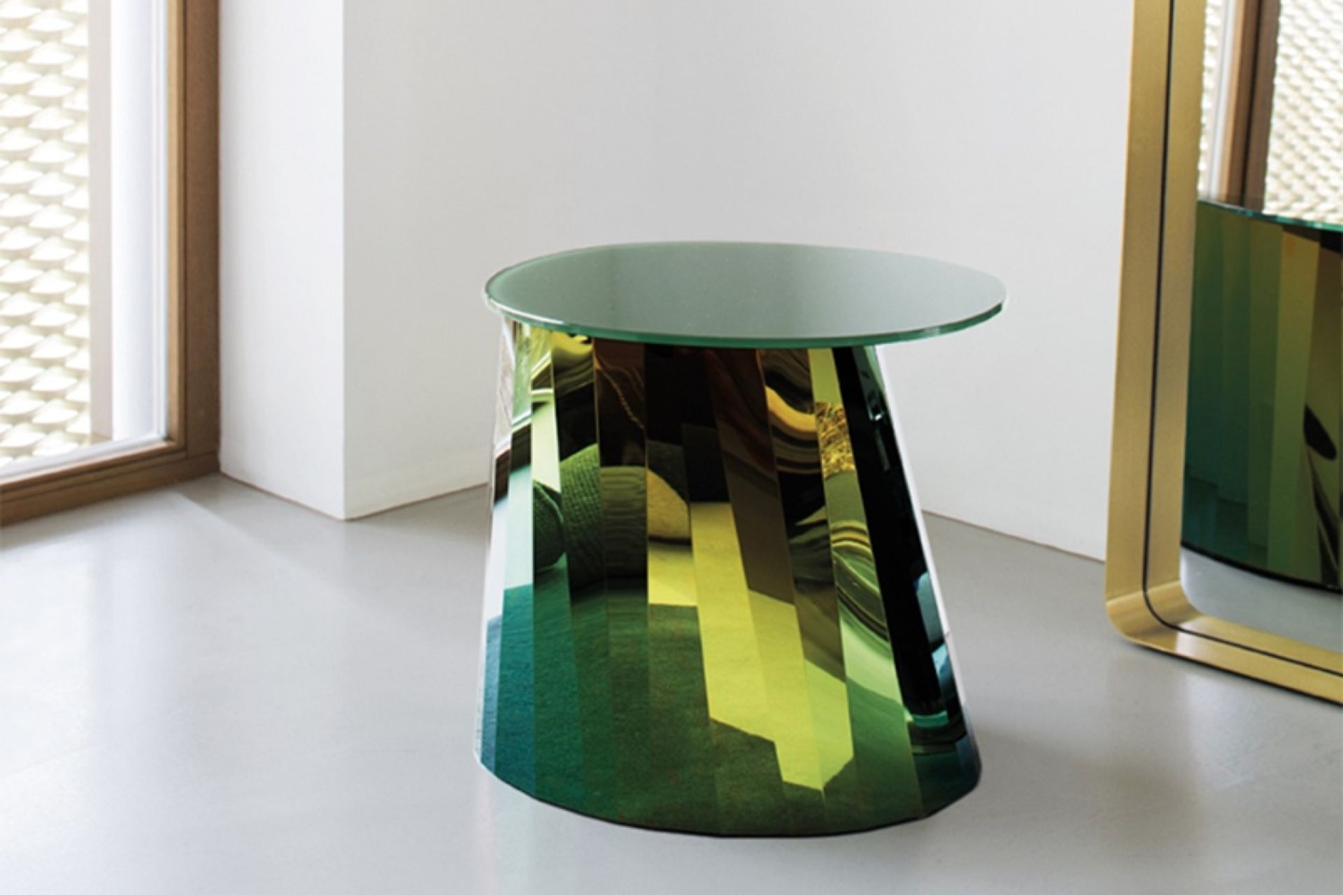 They don't get more glamourous and glossy than the Pli Side Table by Classicon