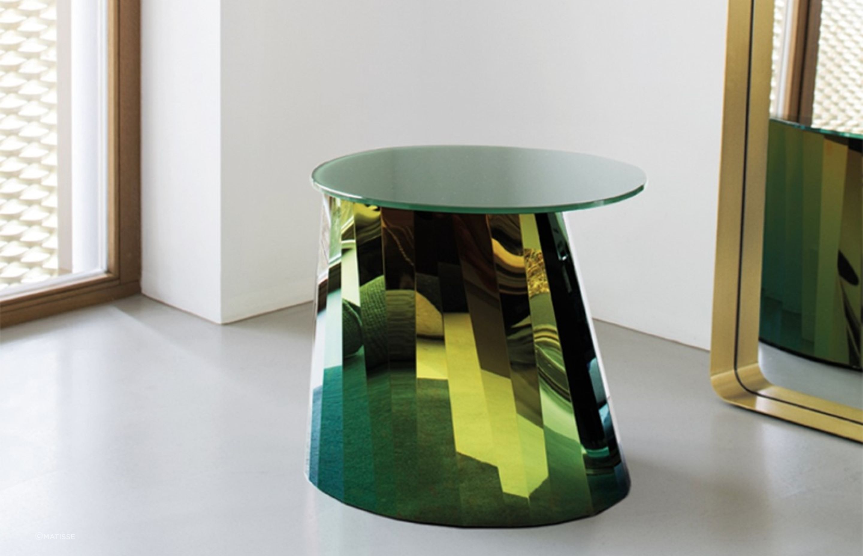 They don't get more glamourous and glossy than the Pli Side Table by Classicon