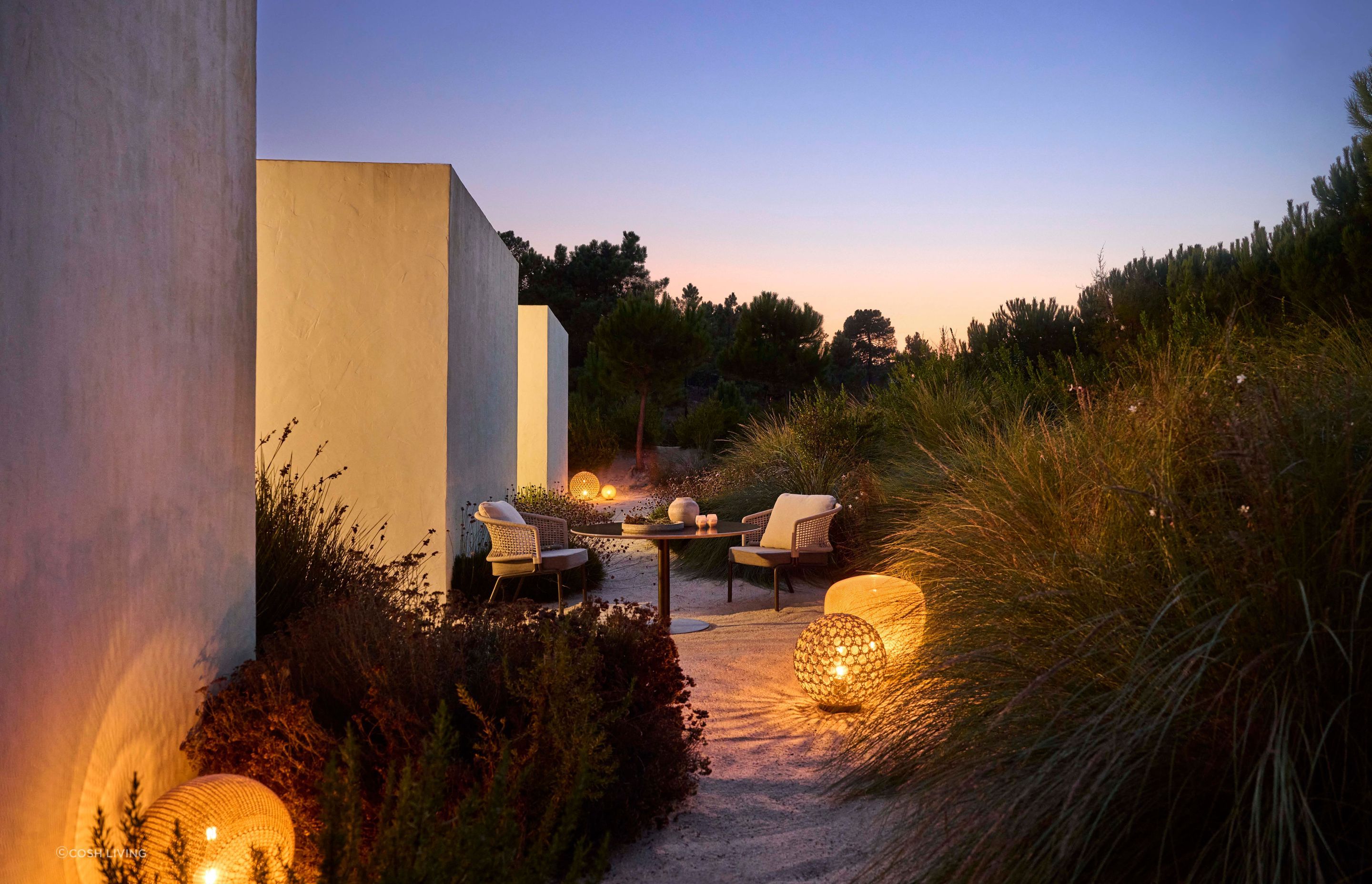 Integrate the Monsieur Tricot lighting with textural outdoor furniture for a seamless indoor/outdoor experience.