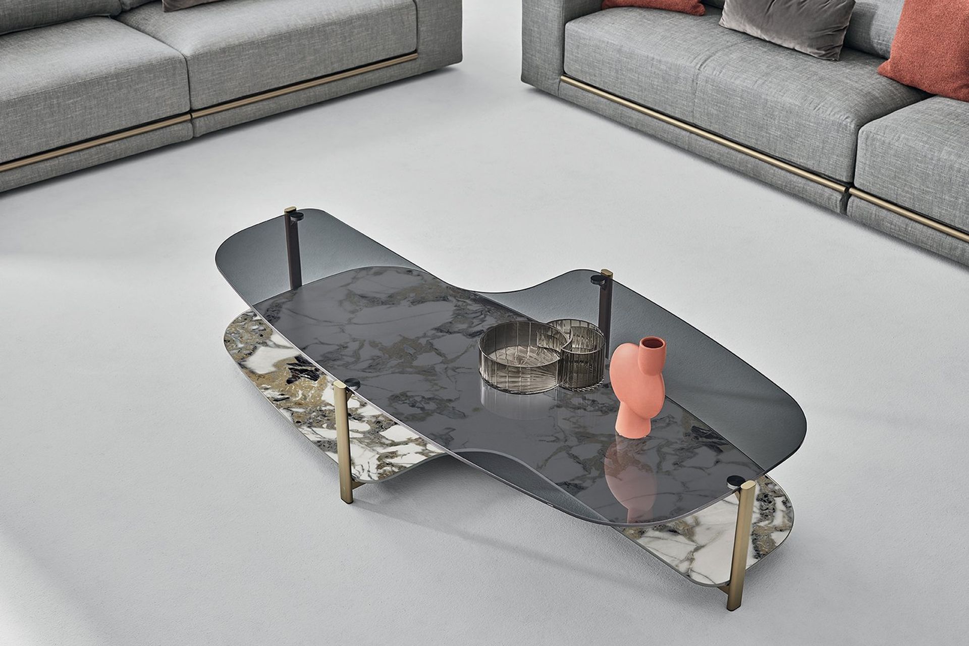 This double-layered coffee table provides extra space while showcasing a glass tabletop and a marble surface.