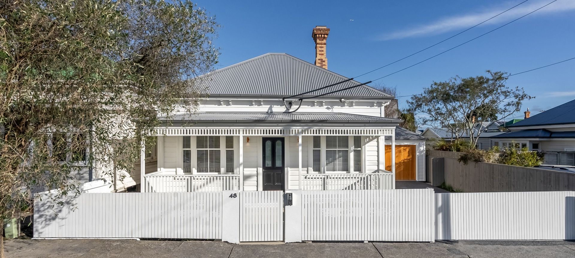 A quality wooden fence complements this villa renovation in Ponsonby with timber products supplied by South Pacific Timbers.