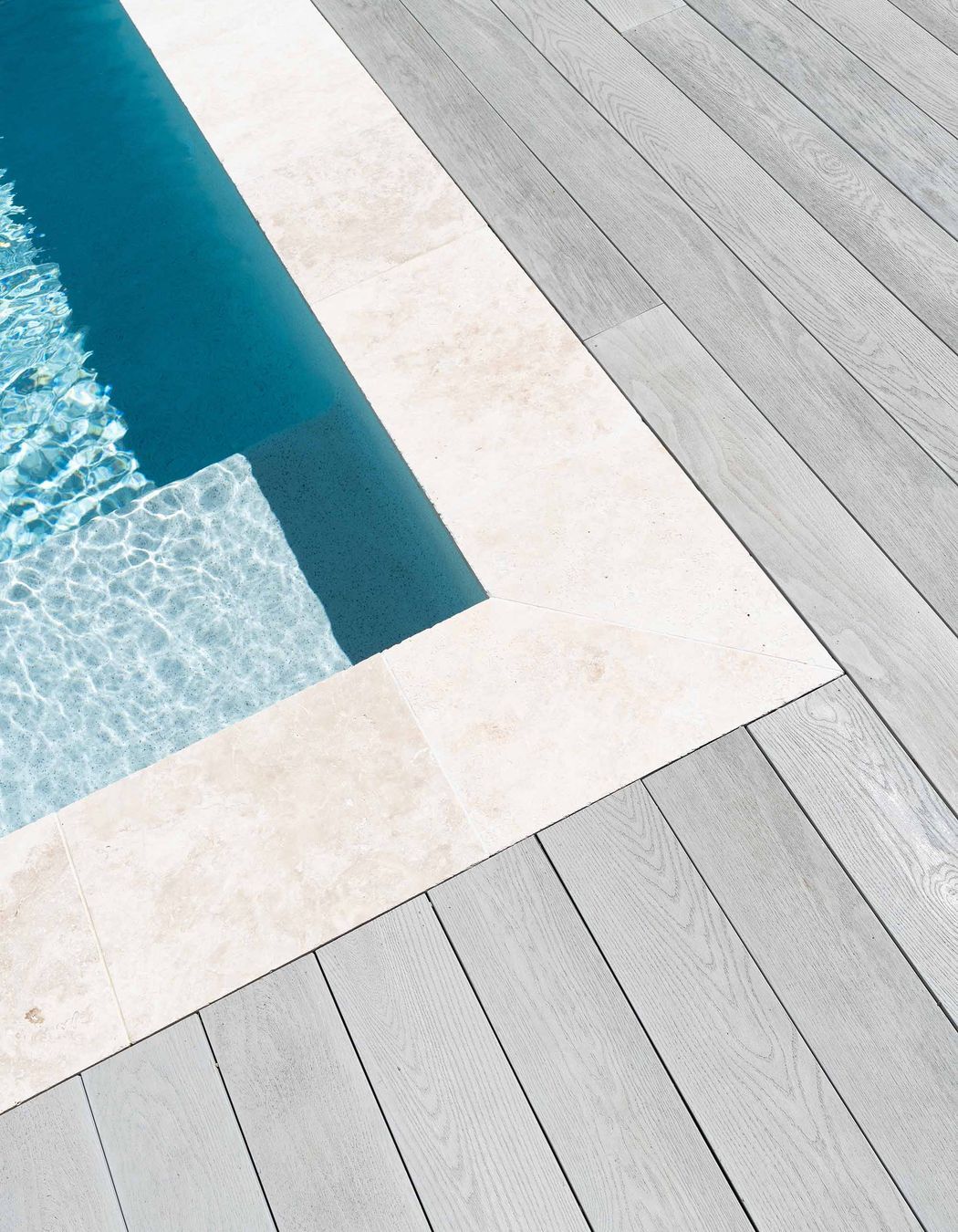 "Millboard Smoked Oak was the decking colour of choice for this beautiful home as it ticked all the boxes. The classic silver grey colour complementing the soft calming pallet of the home as it wrapped around the front porch and pool area."