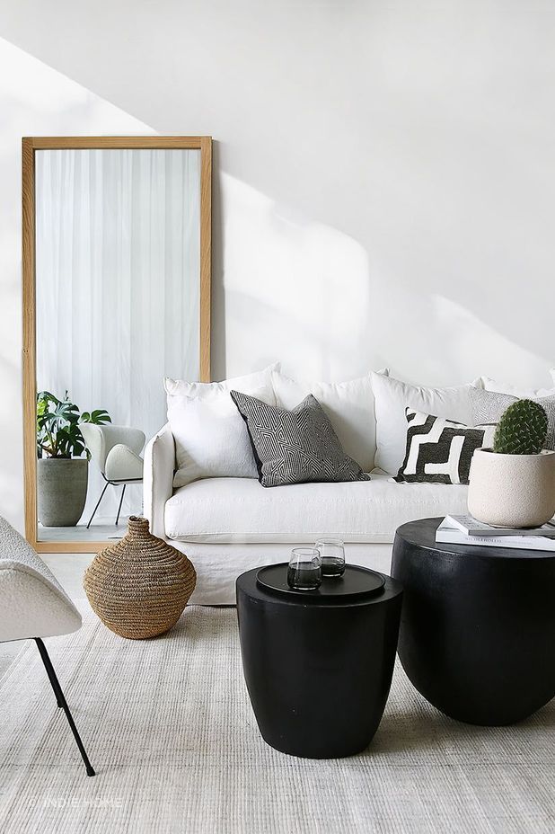 The Oak Mirror stylishly adds depth to this space.