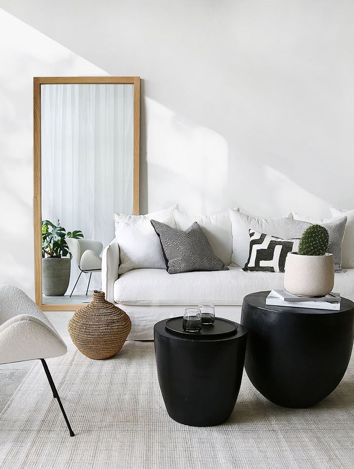 The Oak Mirror stylishly adds depth to this space.