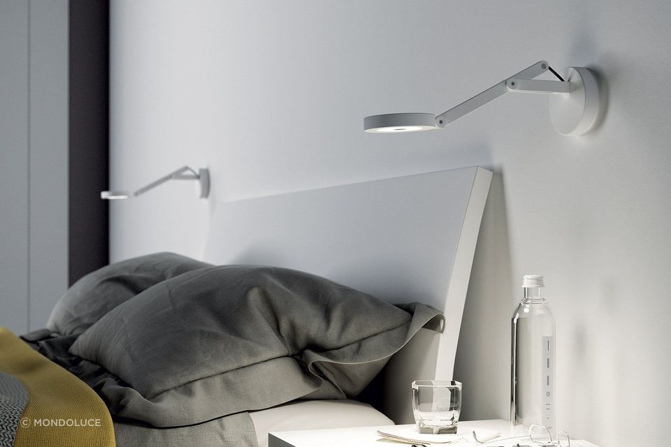 Bedside wall lights, like these String W0 Wall Lamp
By Mondoluce, are a great choice for those who enjoy an evening read.