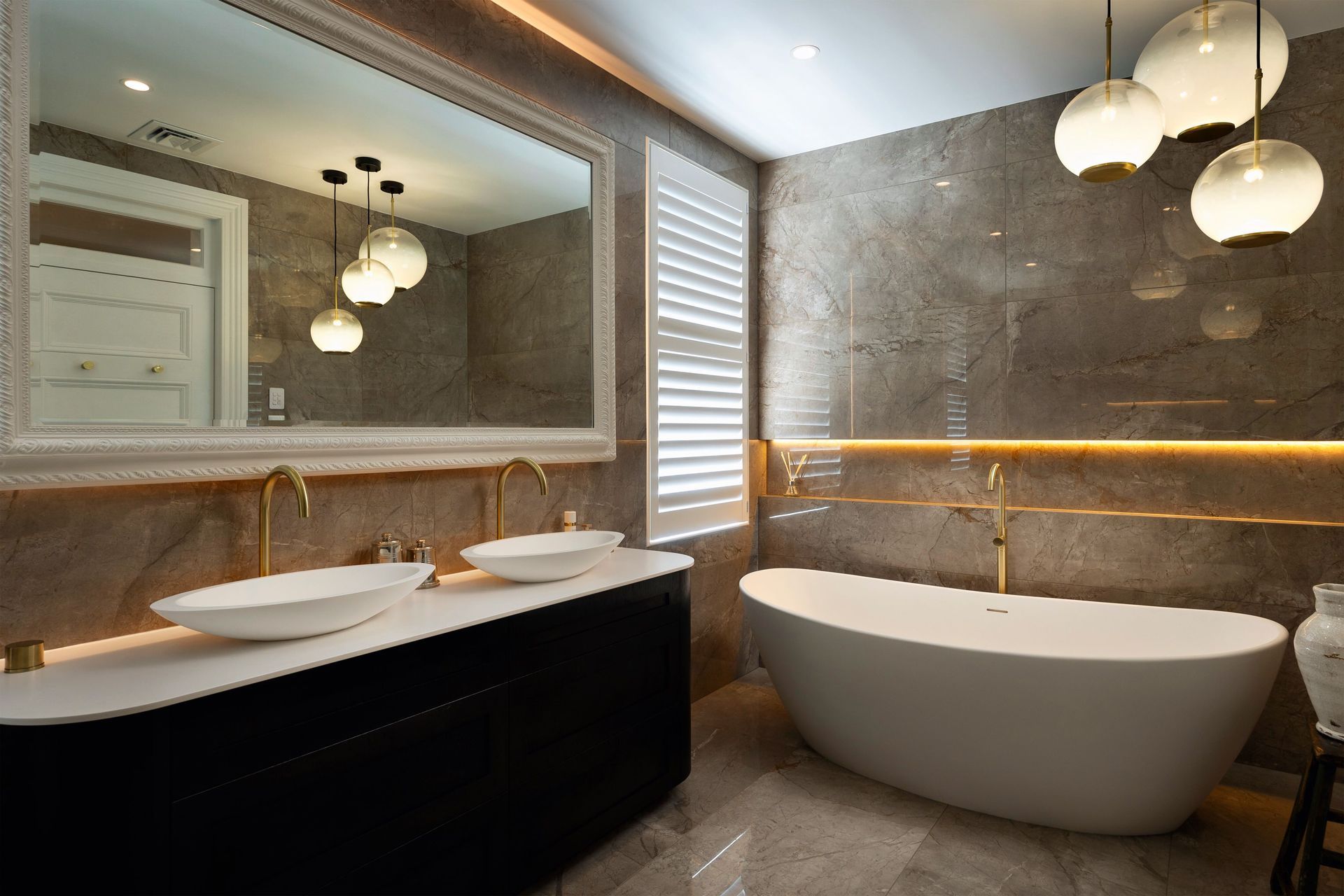 The exquisite natural veining of marble beautifies this Remuera bathroom renovation.