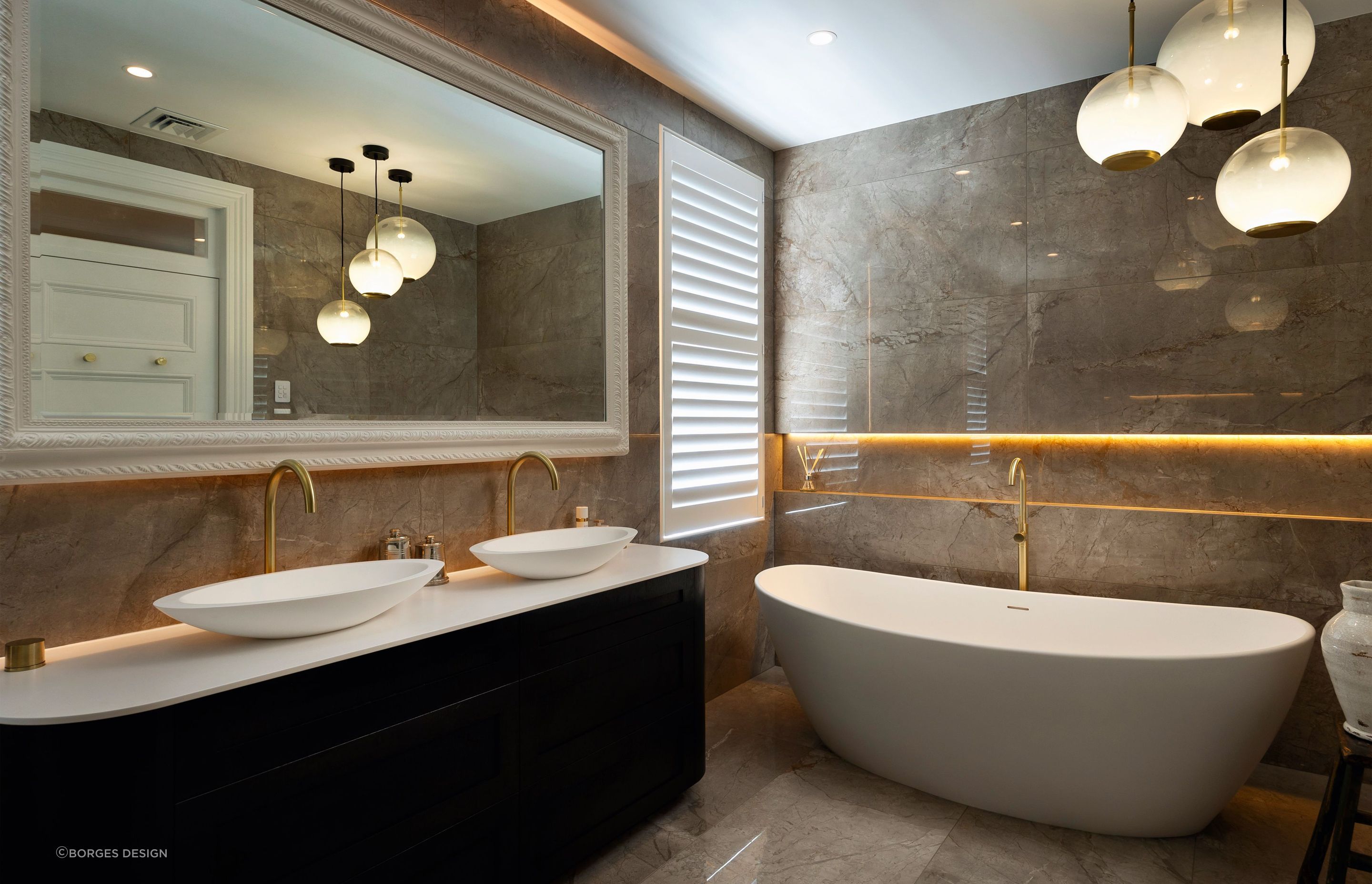 The exquisite natural veining of marble beautifies this Remuera bathroom renovation.