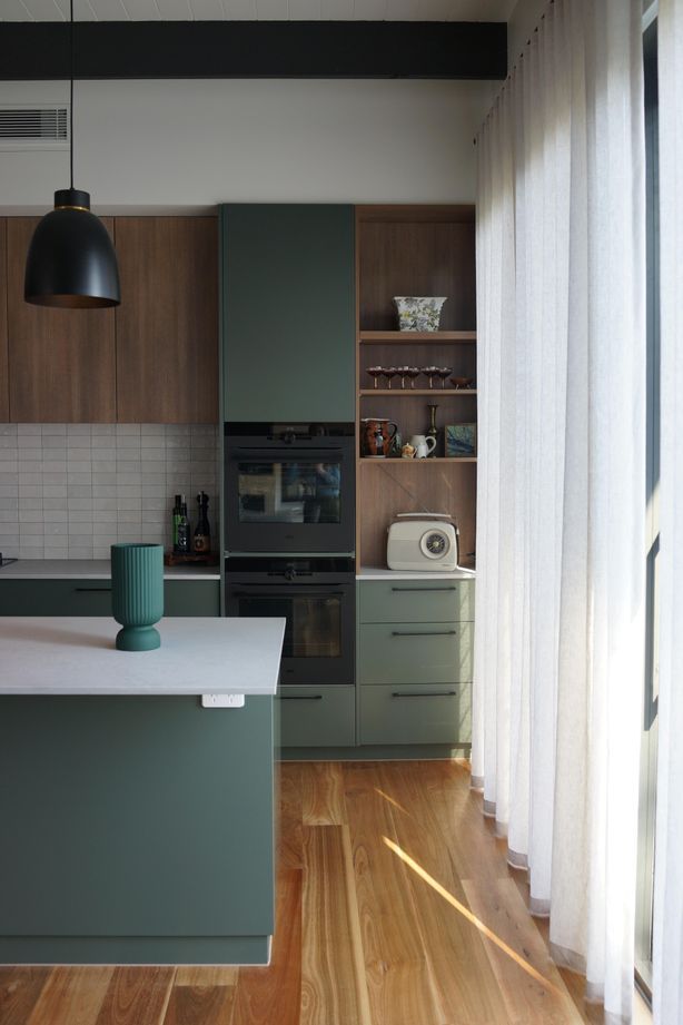 A stunning green-toned kitchen by Ilm Interiors.