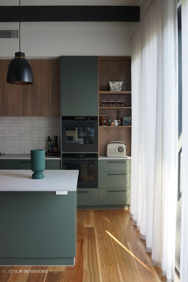 A stunning green-toned kitchen by Ilm Interiors.