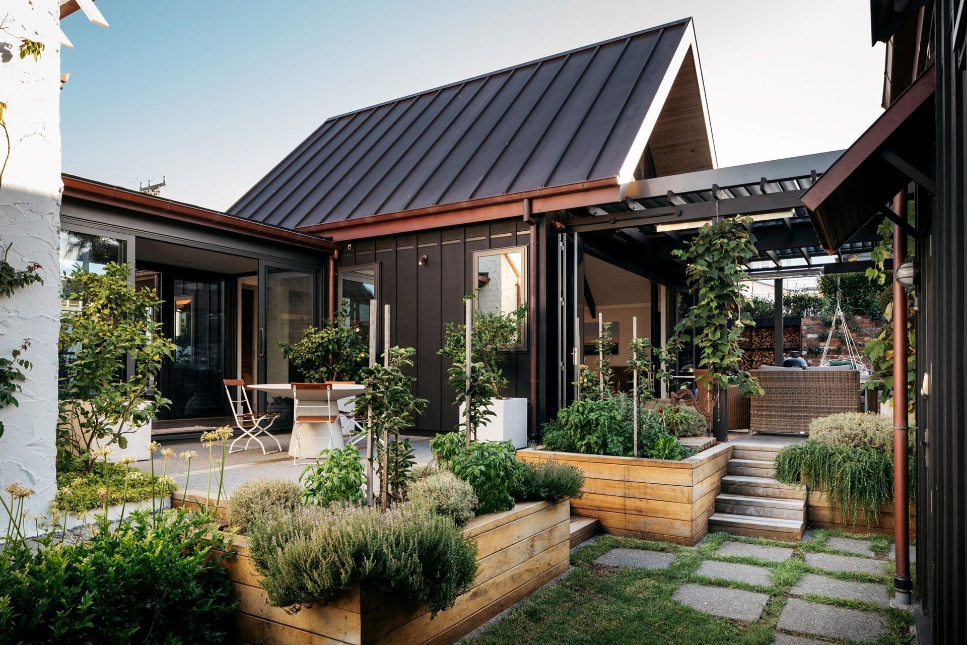 The inclusion of a few fruit trees can bring a feeling of freshness and vitality, seen here in this exquisite home in Rewiti.