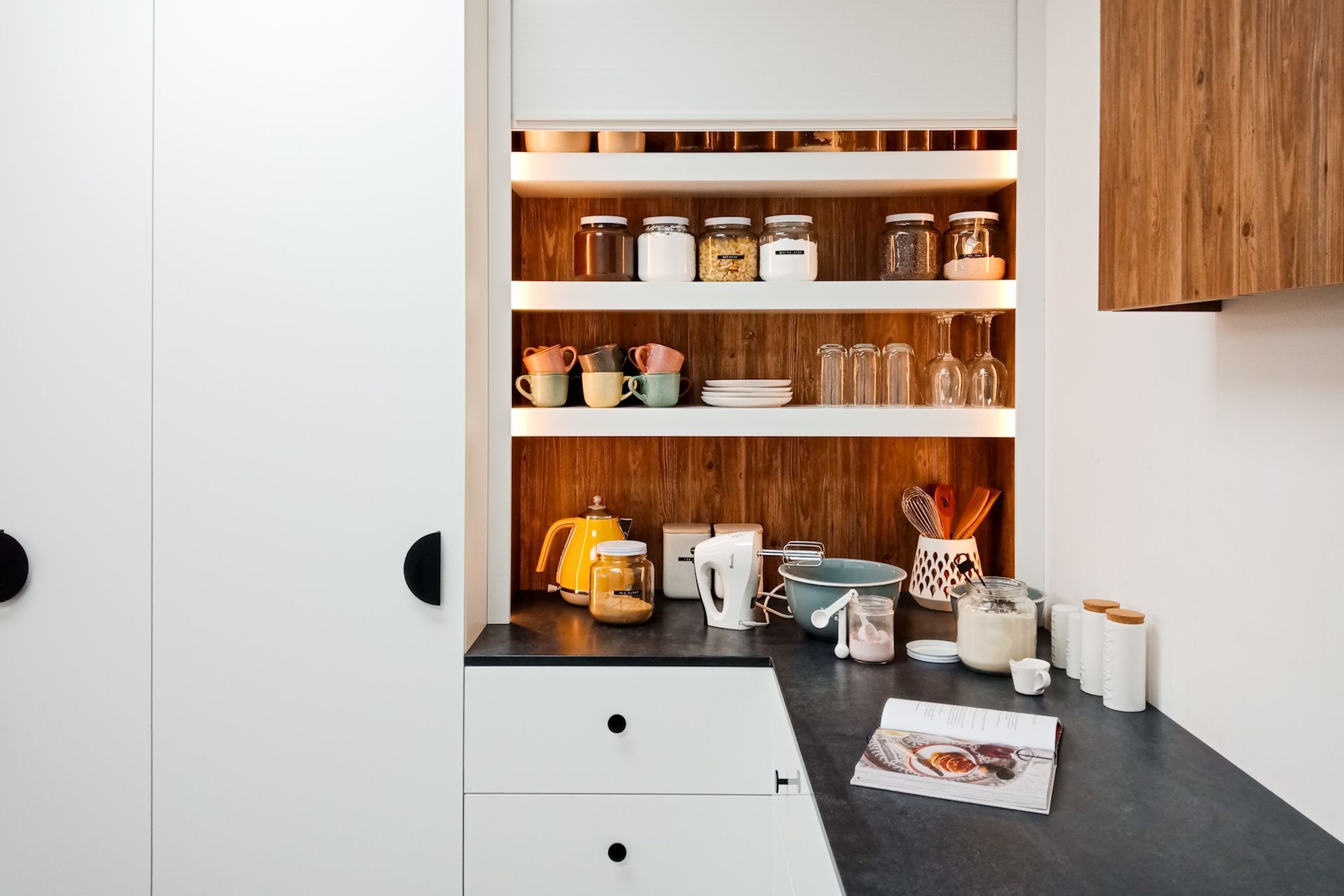 Cabinet knobs are a great option that are user-friendly and versatile, seen here with the stylish Single Sided Roller Door.