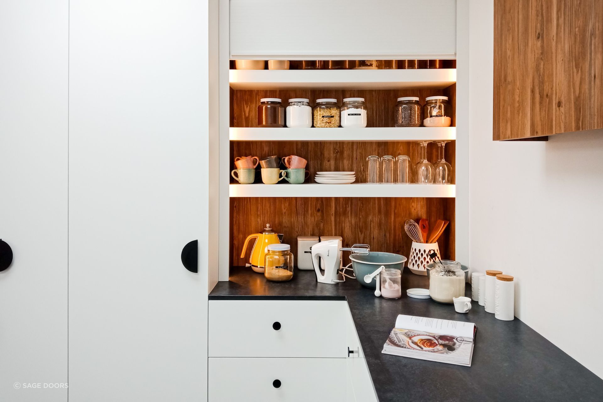 Cabinet knobs are a great option that are user-friendly and versatile, seen here with the stylish Single Sided Roller Door.