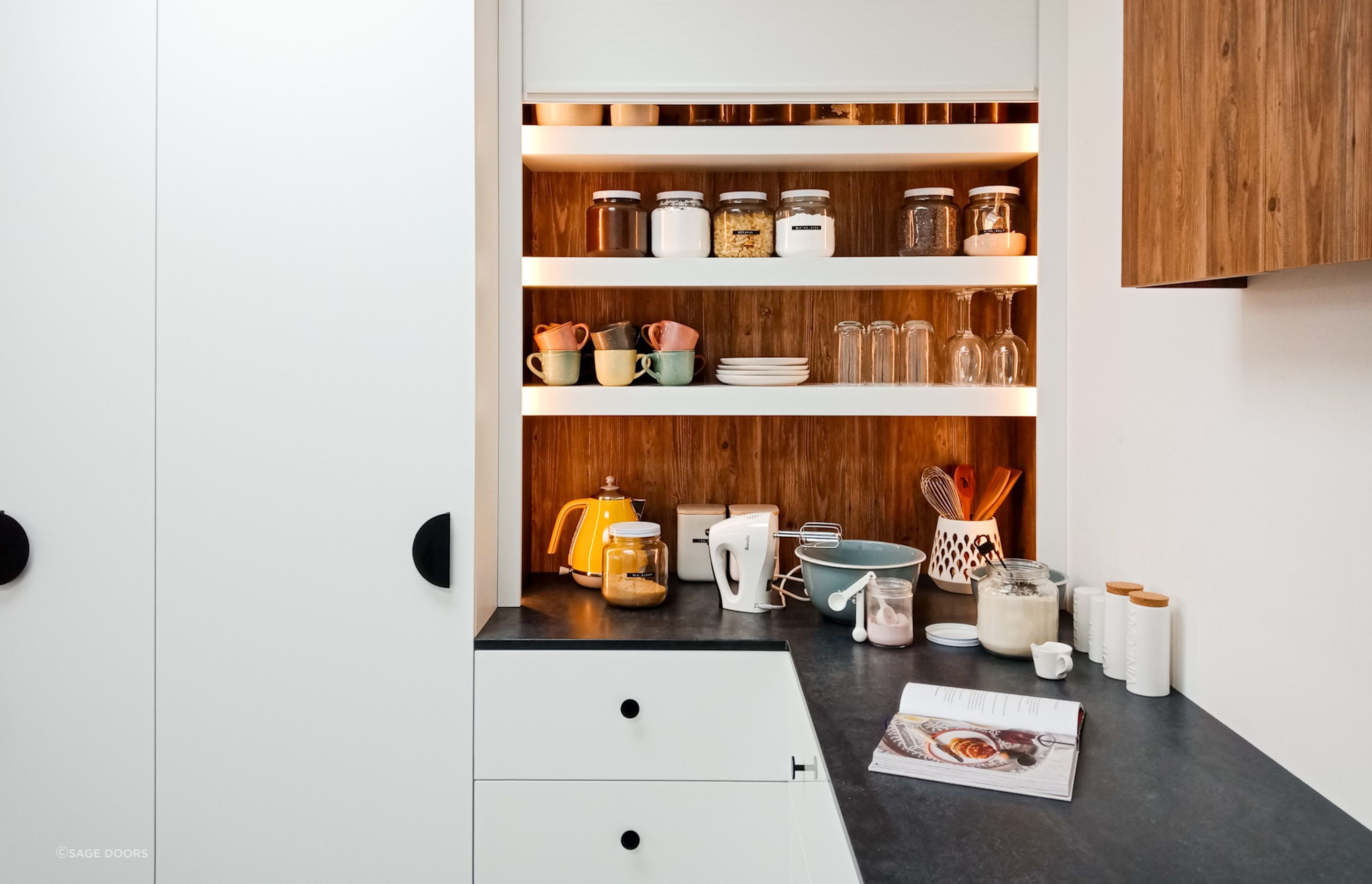Cabinet knobs are a great option that are user-friendly and versatile, seen here with the stylish Single Sided Roller Door.