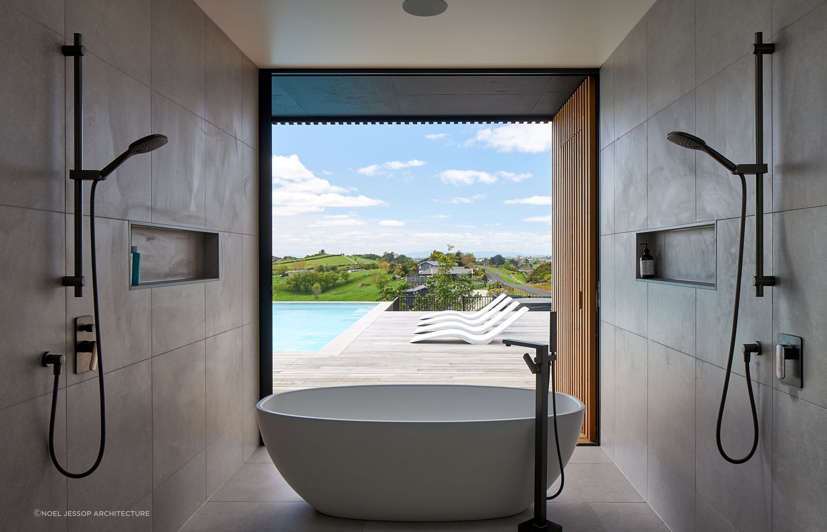 The showers help frame the beautiful view at the S&amp;P House on the outskirts of Hamilton — Photography: Simon Wilson