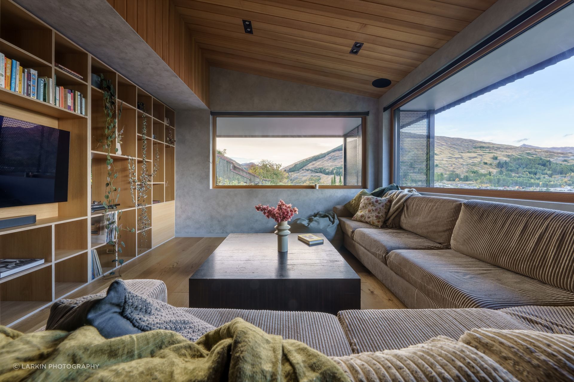 At Moonlight Tui by Team Green Architects, wide overhangs protect the north-facing living space from overheating.