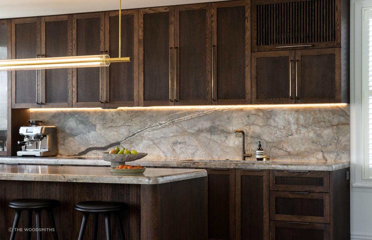 Solid wood cabinets, like these beautiful ones by The Woodsmiths, bring warmth and texture into a space.
