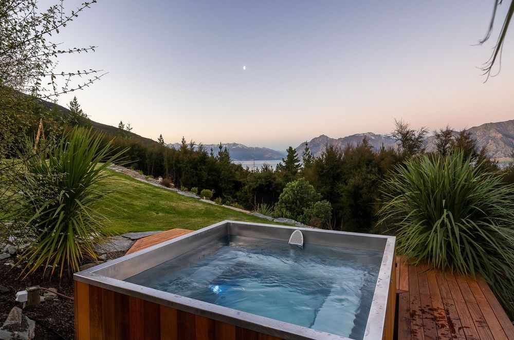 Crafted with a handcrafted wooden exterior the Stainless Steel Square Spa by Stoked Stainless is a refined and luxurious choice.