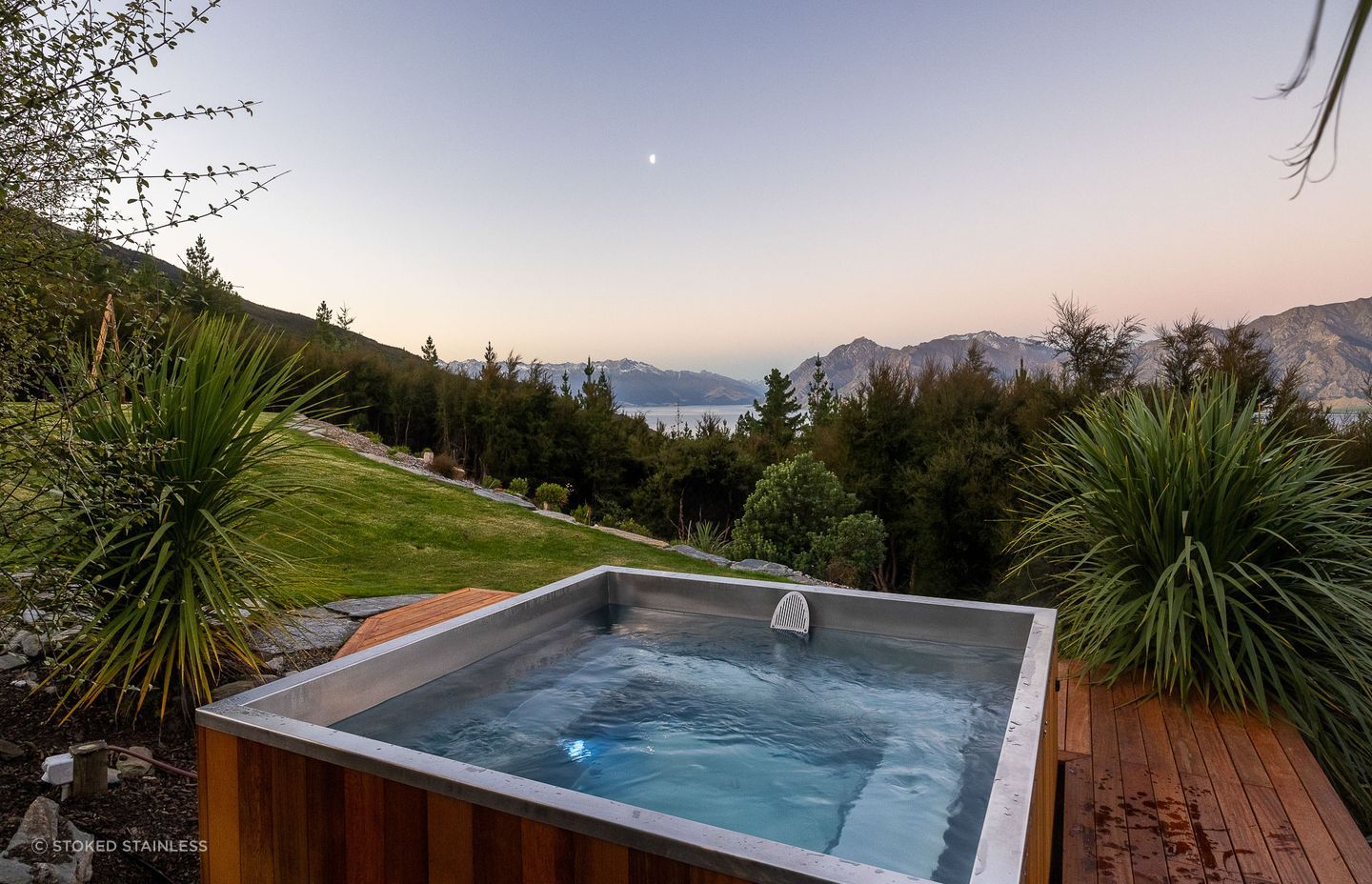 Crafted with a handcrafted wooden exterior the Stainless Steel Square Spa by Stoked Stainless is a refined and luxurious choice.