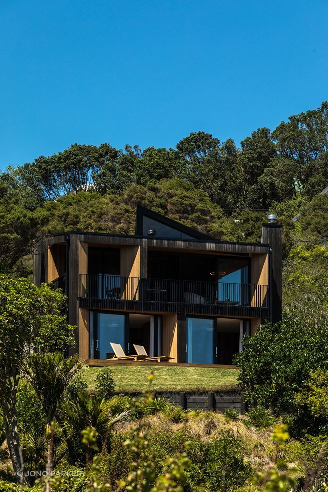 Nestled into a steep Waiheke site, Sandy Bay House demonstrates how careful planning, light and materiality can make a compact home feel generous, warm and deeply connected to place.
Architecture: Stevens Lawson Architects