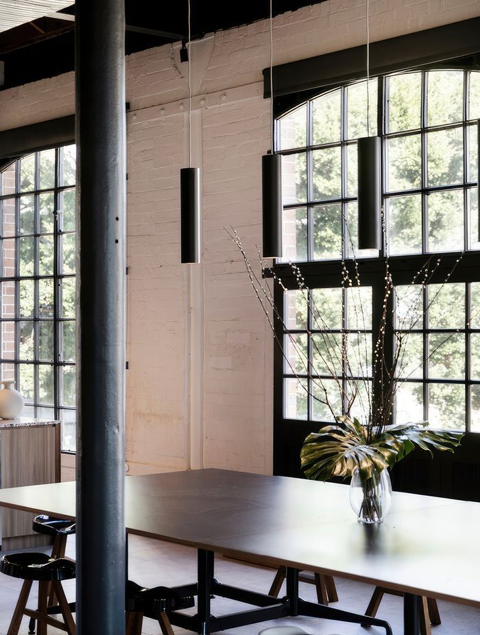 Black pendants mimic nearby pillars.